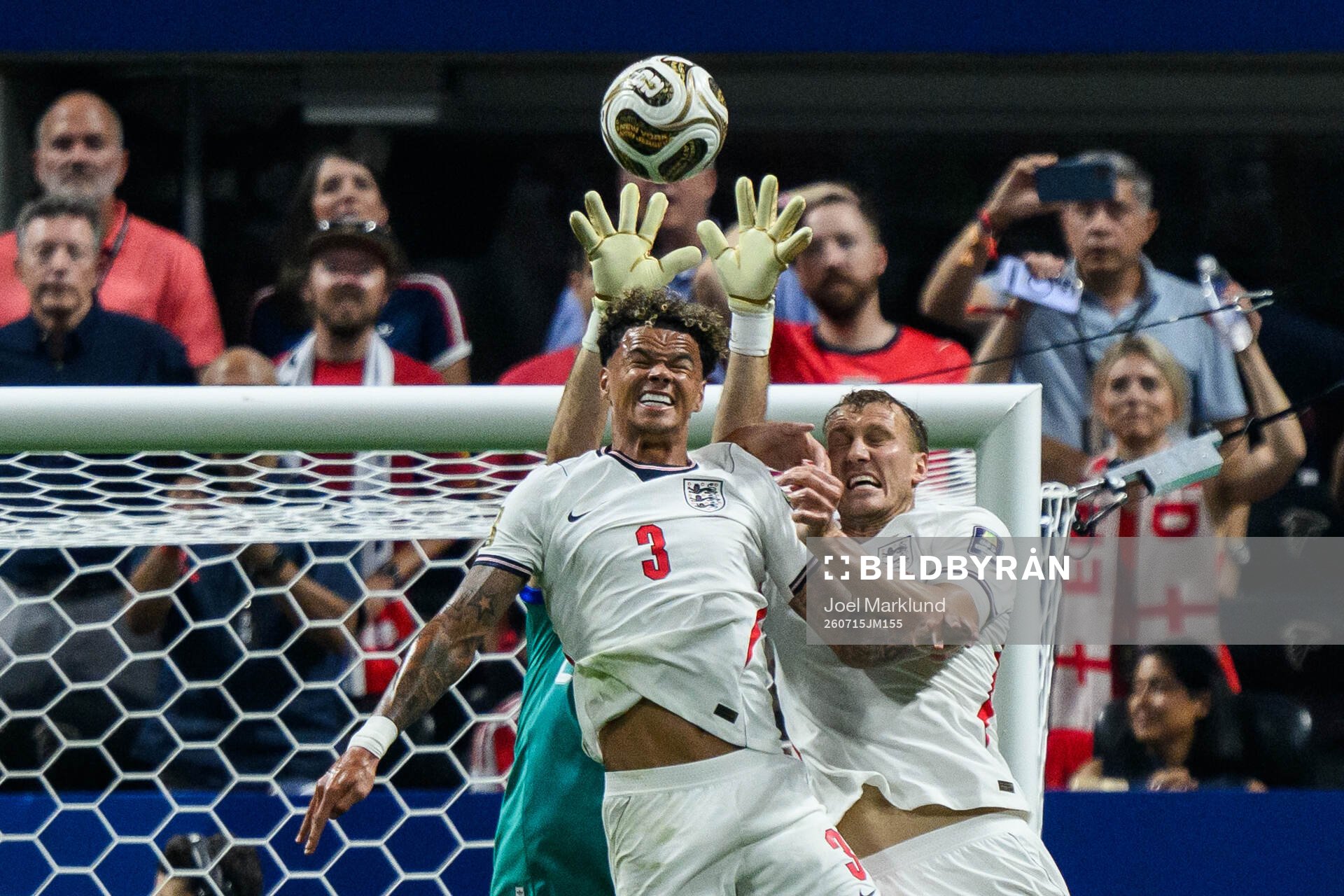 Nico O'Reilly and Dan Burn of England and goalkeeper