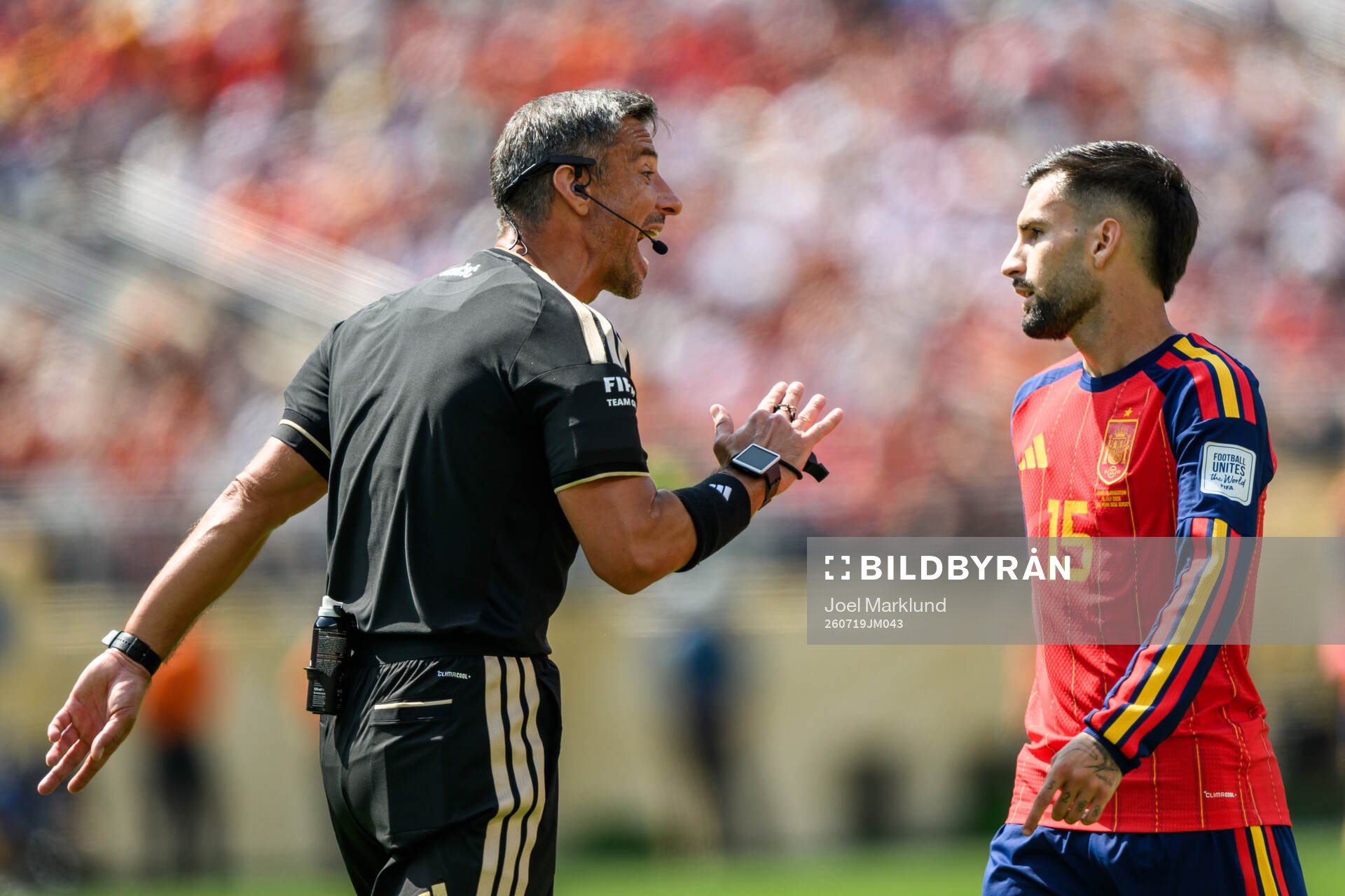 Referee Slavko Vincic and Alex Baena of Spain