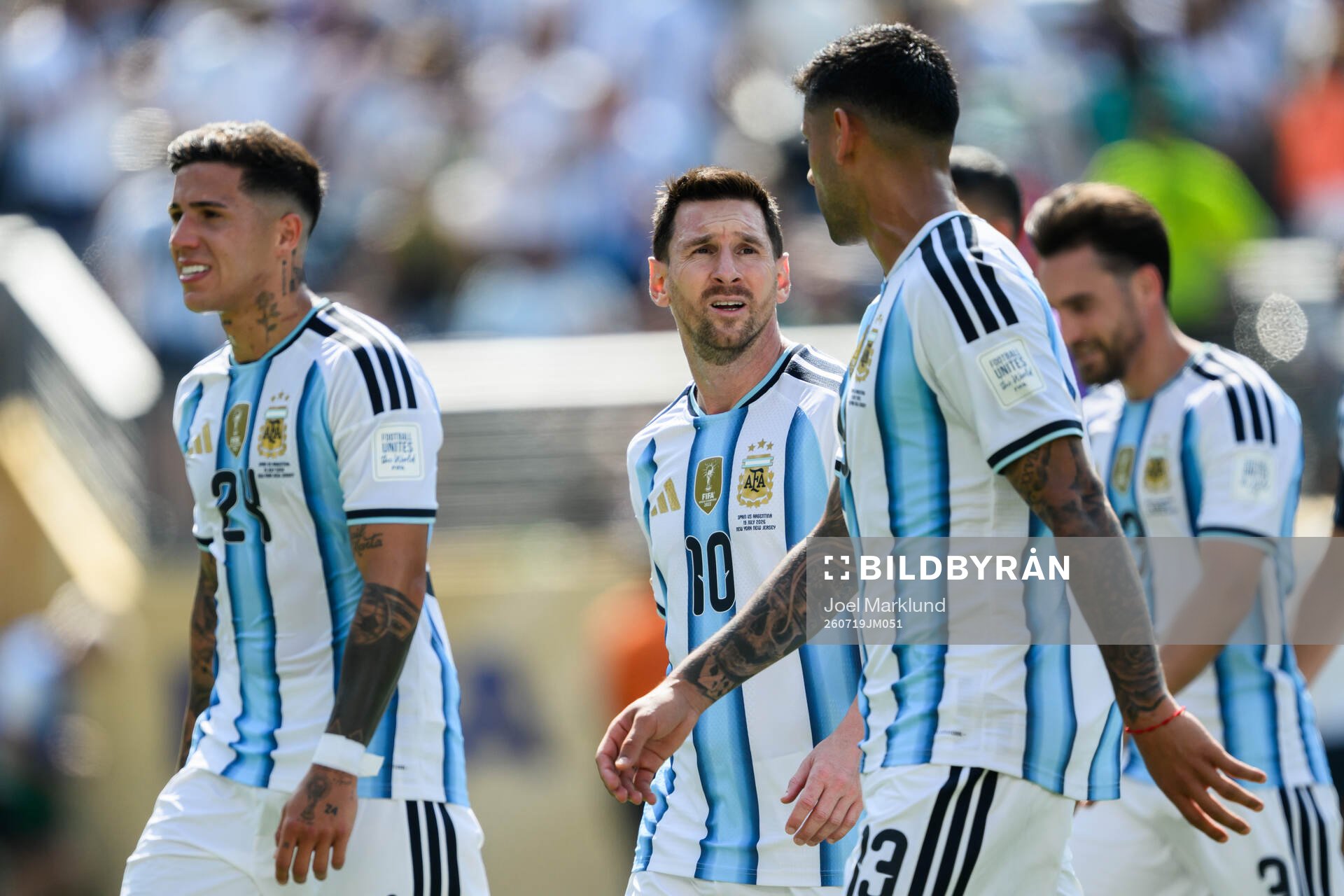 Enzo Fernandez, Lionel Messi and Cristian Romero of