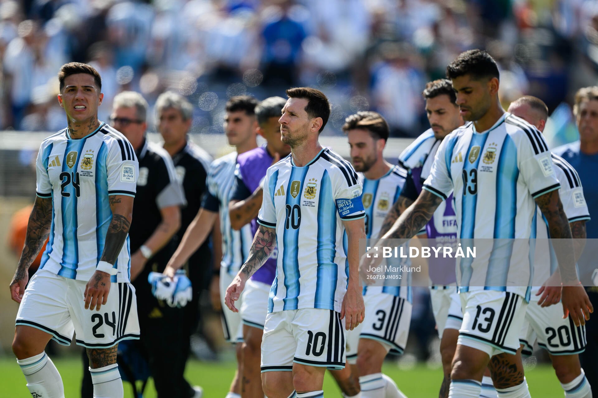 Enzo Fernandez Lionel Messi and Cristian Romero of