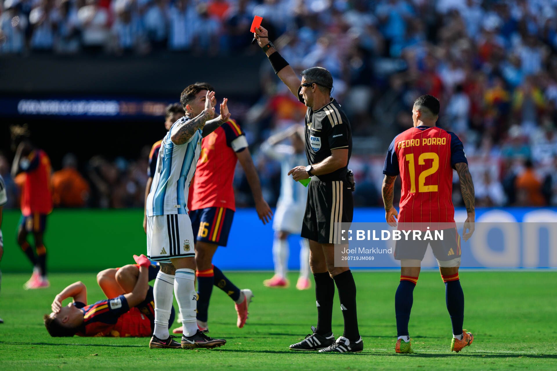 Enzo Fernandez of Argentina is shown a red card by Referee