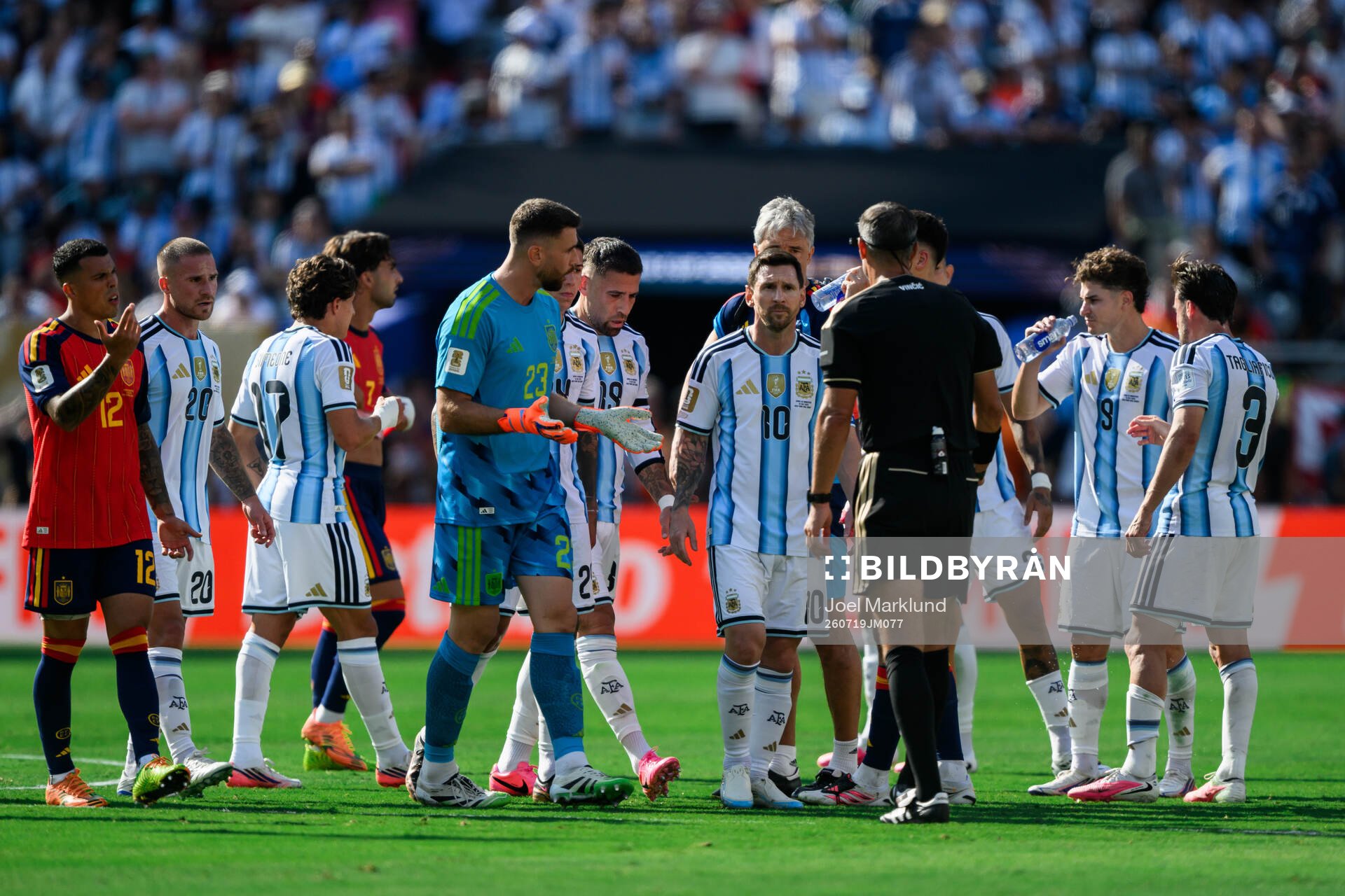 goalkeeper Unai Simon of Spain and Lionel Messi of