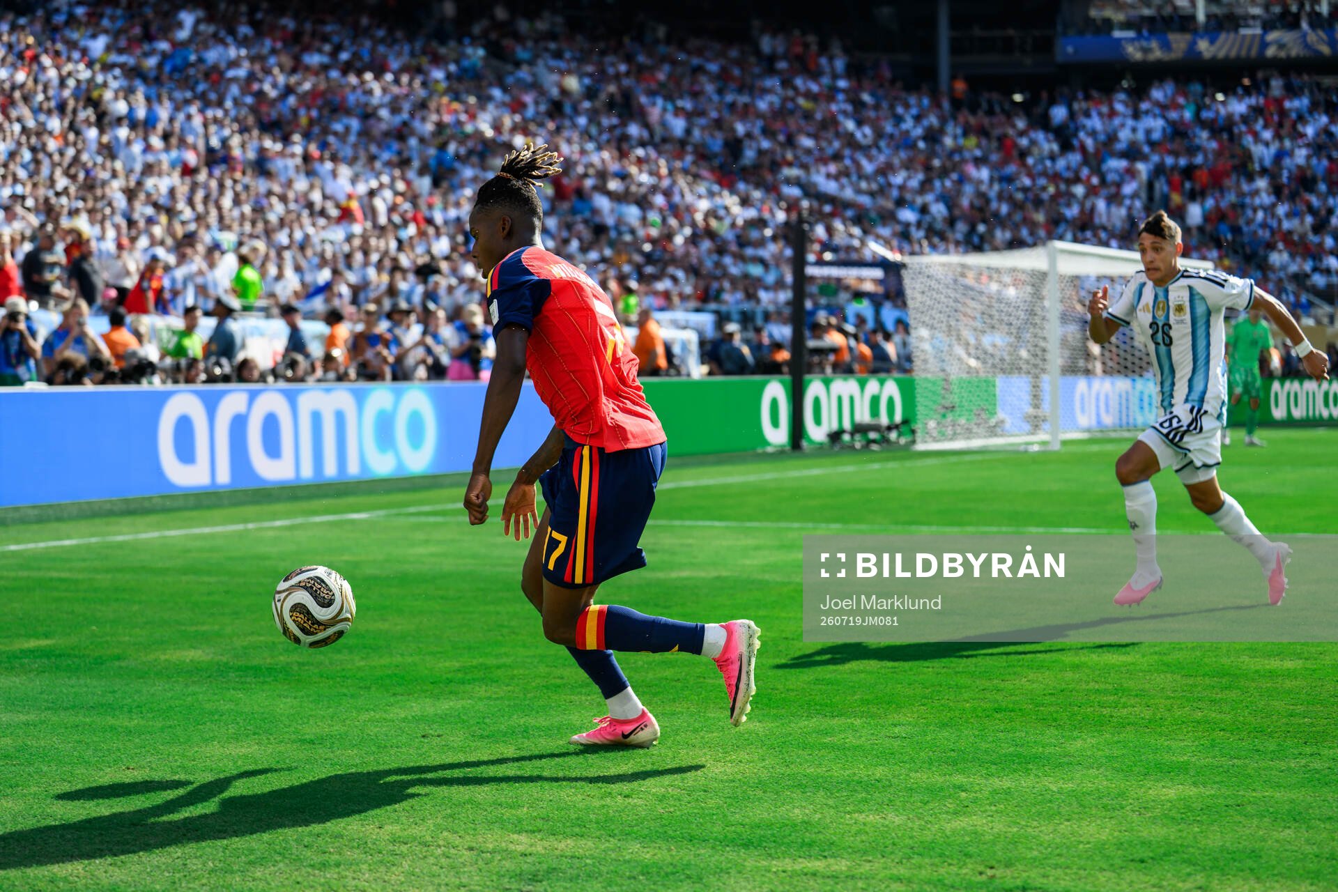 Nico Williams of Spain and Nahuel Molina of Argentina