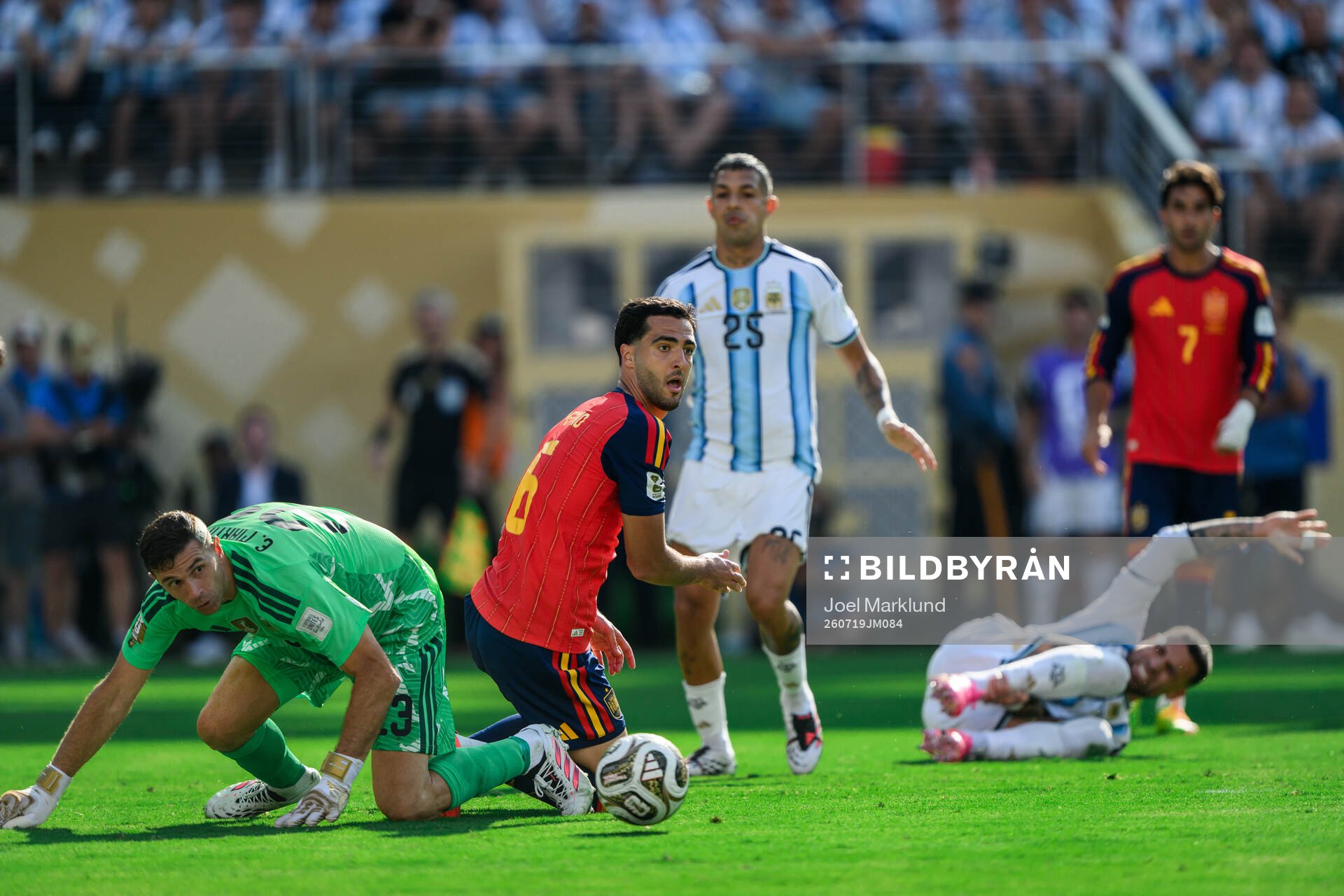 goalkeeper Emiliano Martinez of Argentina and Mikel Merino