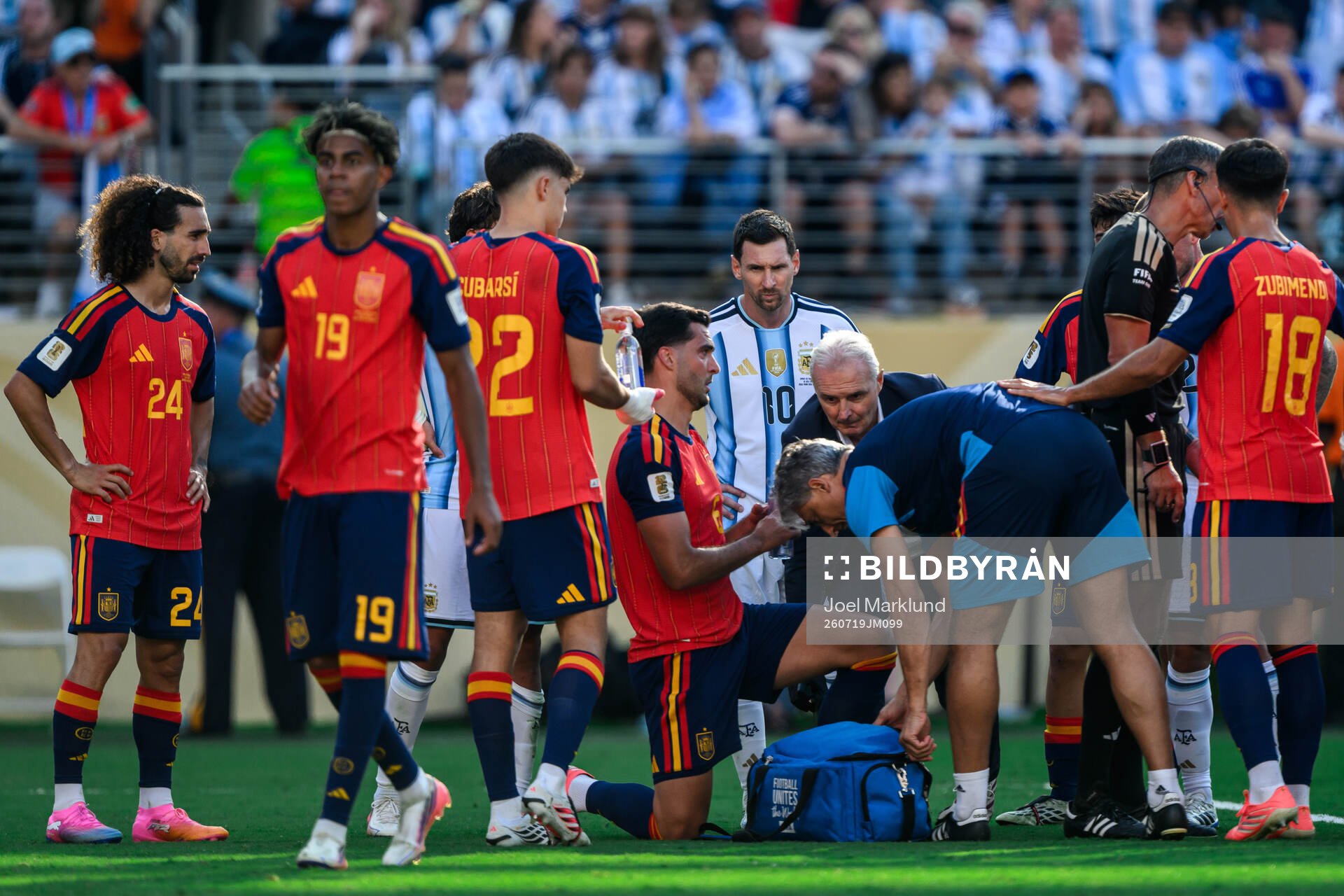 Lionel Messi of Argentina and Mikel Merino of Spain