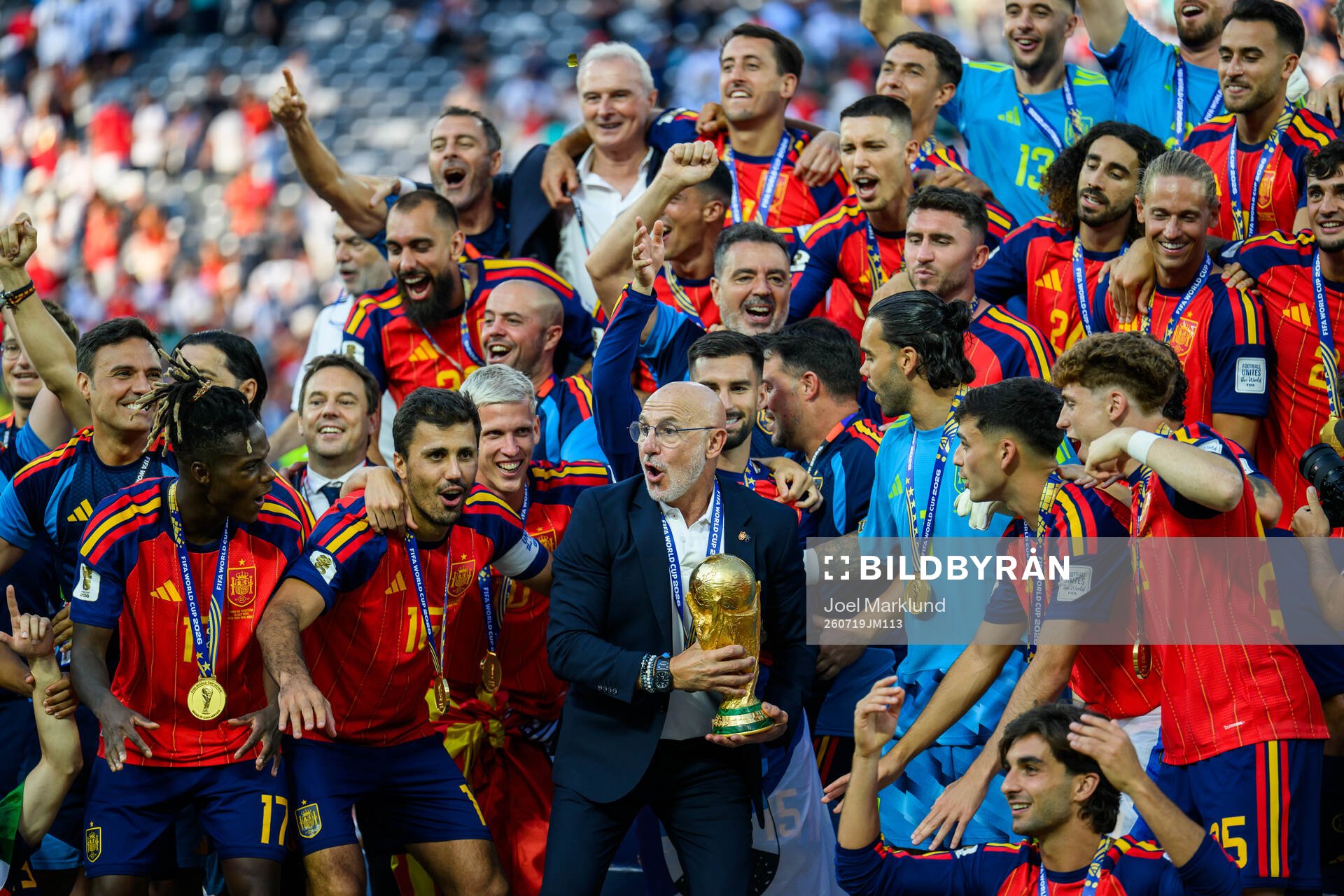 Head coach Luis De La Fuente Castillo of Spain hoists the