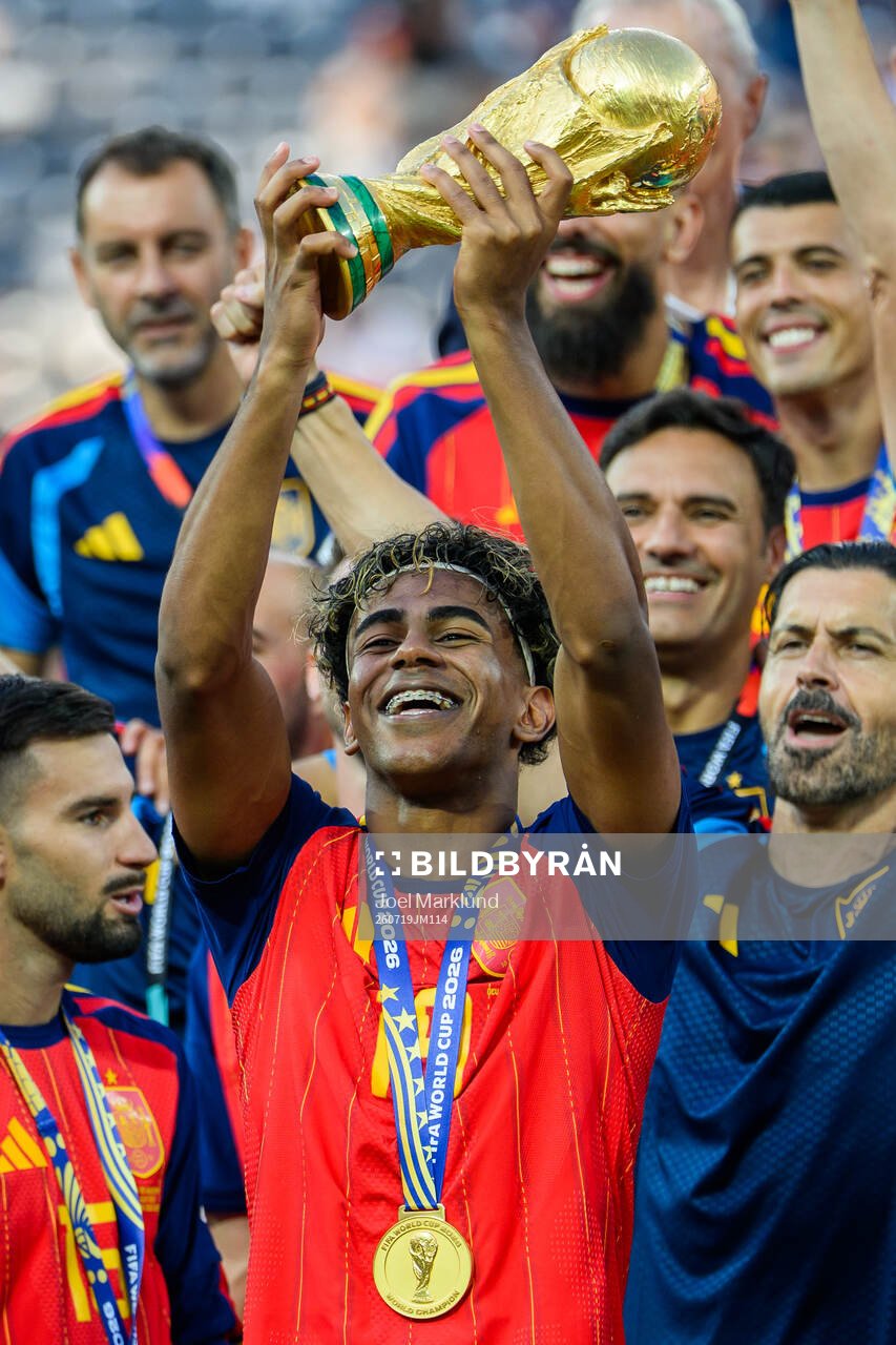 Lamine Yamal of Spain hoists the trophy