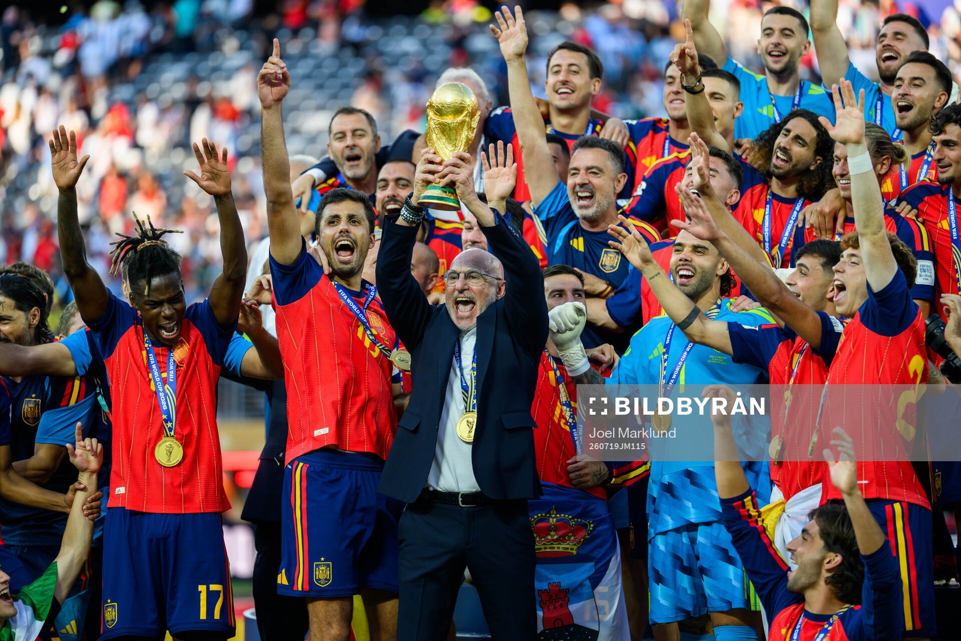 Head coach Luis De La Fuente Castillo of Spain hoists the
