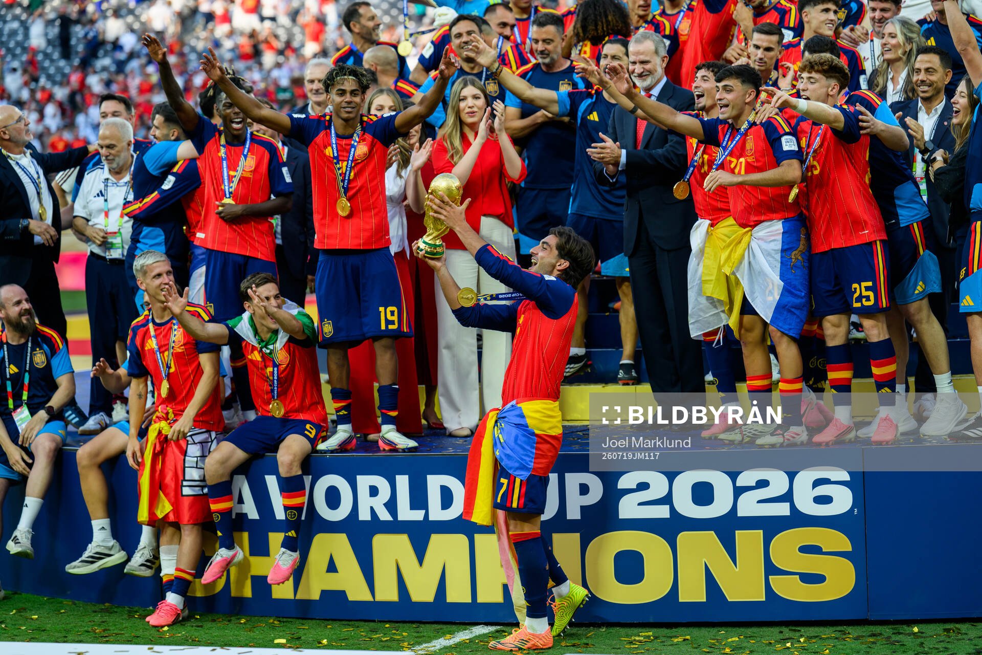 Ferran Torres of Spain hoists the trophy
