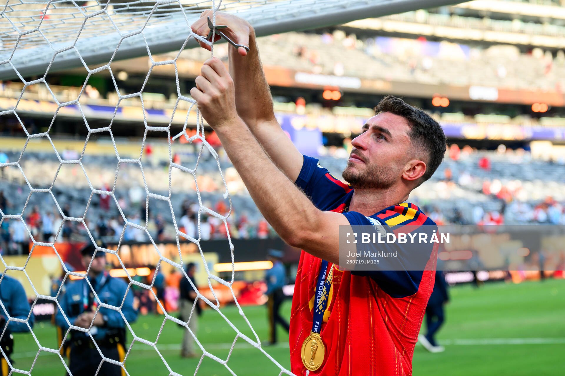 Aymeric Laporte of Spain cuts the net