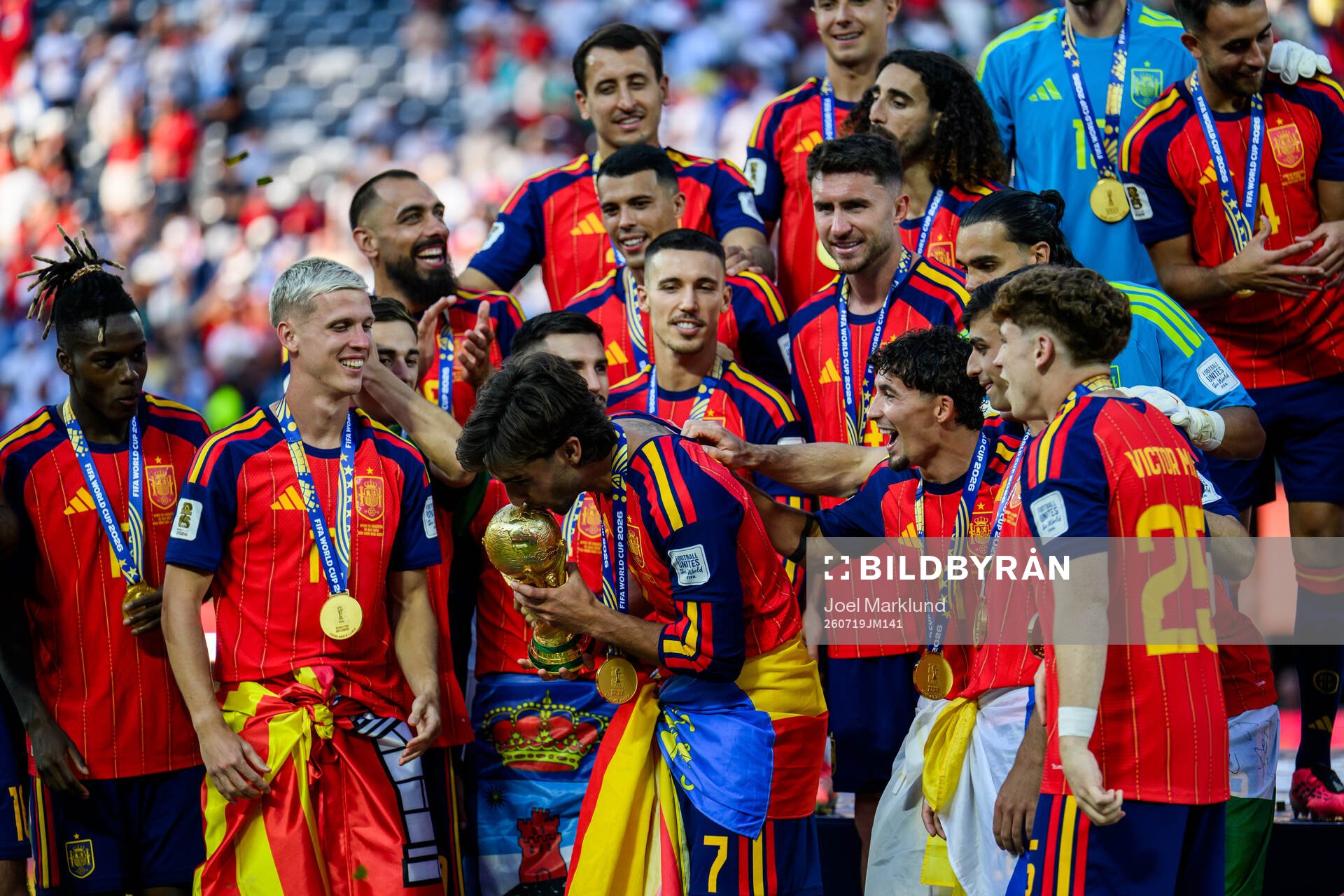 Ferran Torres of Spain kisses the trophy
