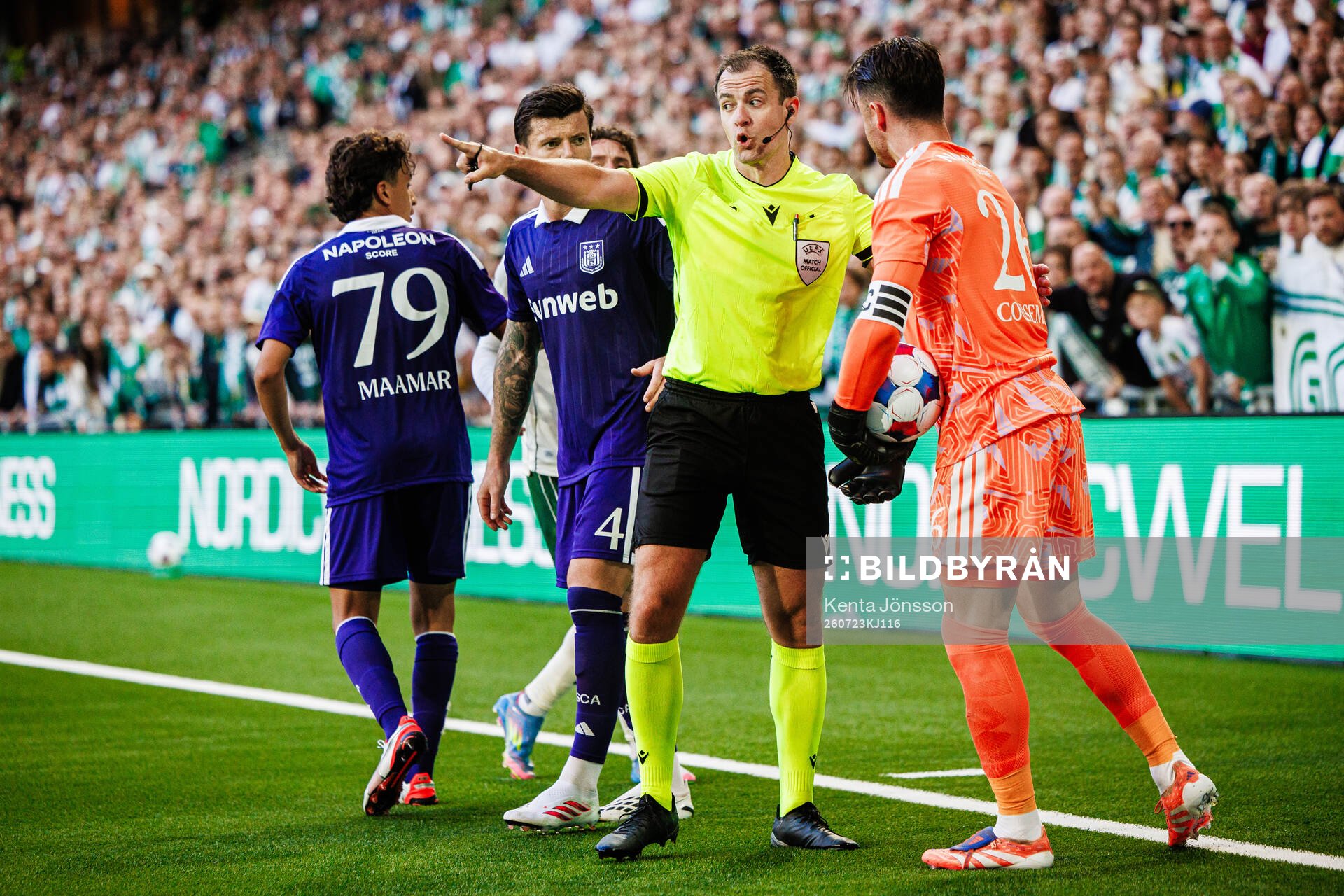 Referee Donald Robertson and goalkeeper Colin Coosemans of