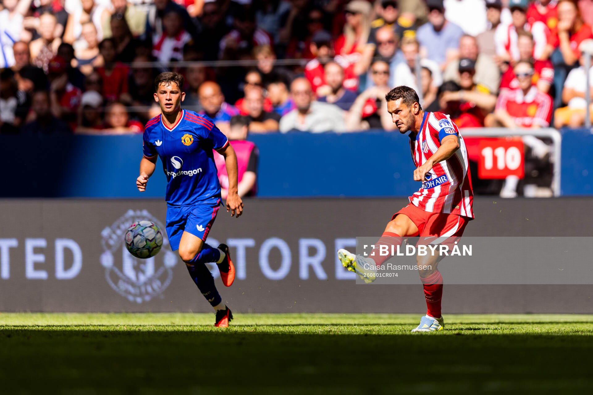 Shea Lacey of Manchester United and Koke of Atletico de