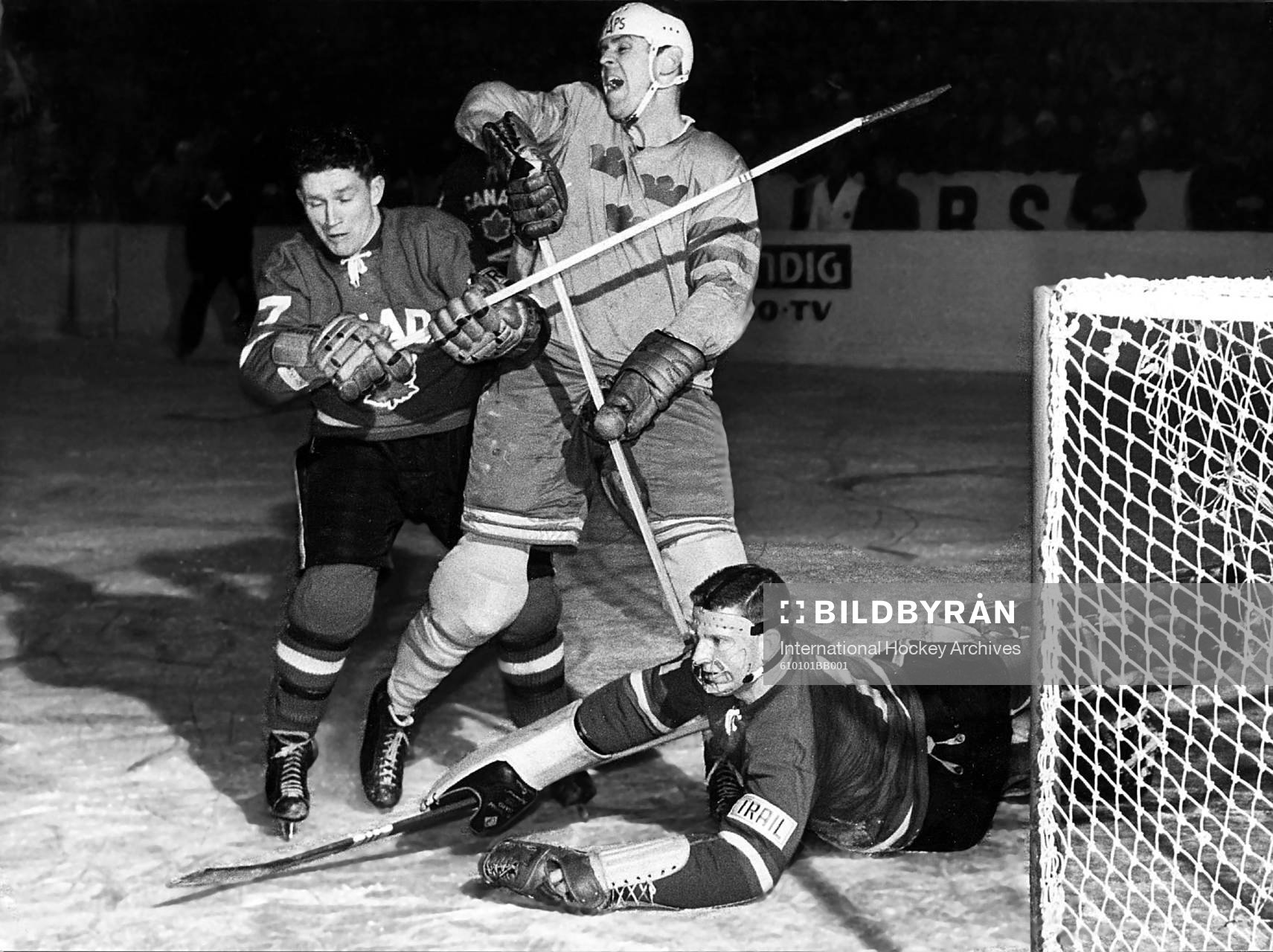 Team Sweden Sven Tumba is checked in front of the net by