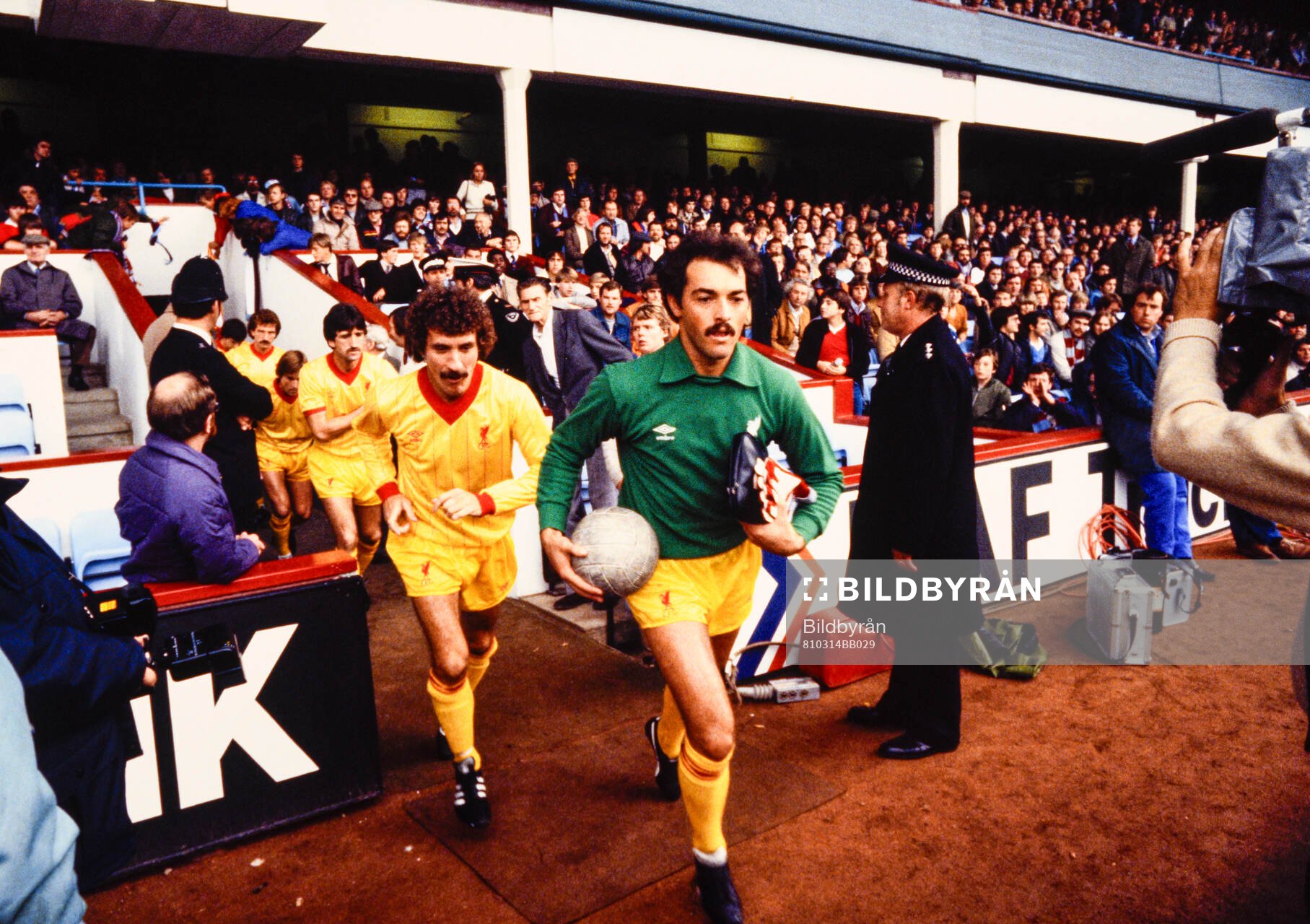 Bruce Grobbelaar and Terry McDermott leads Liverpool out at