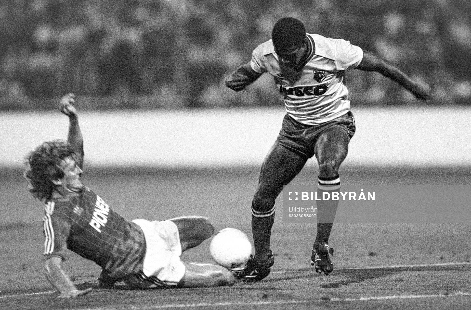 Russel Osman of Ipswich tackles John Barnes of Watford