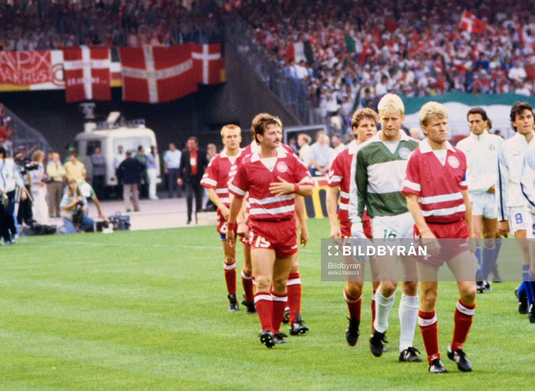 Denmark captain Morten Olsen leads his team out to the pitch