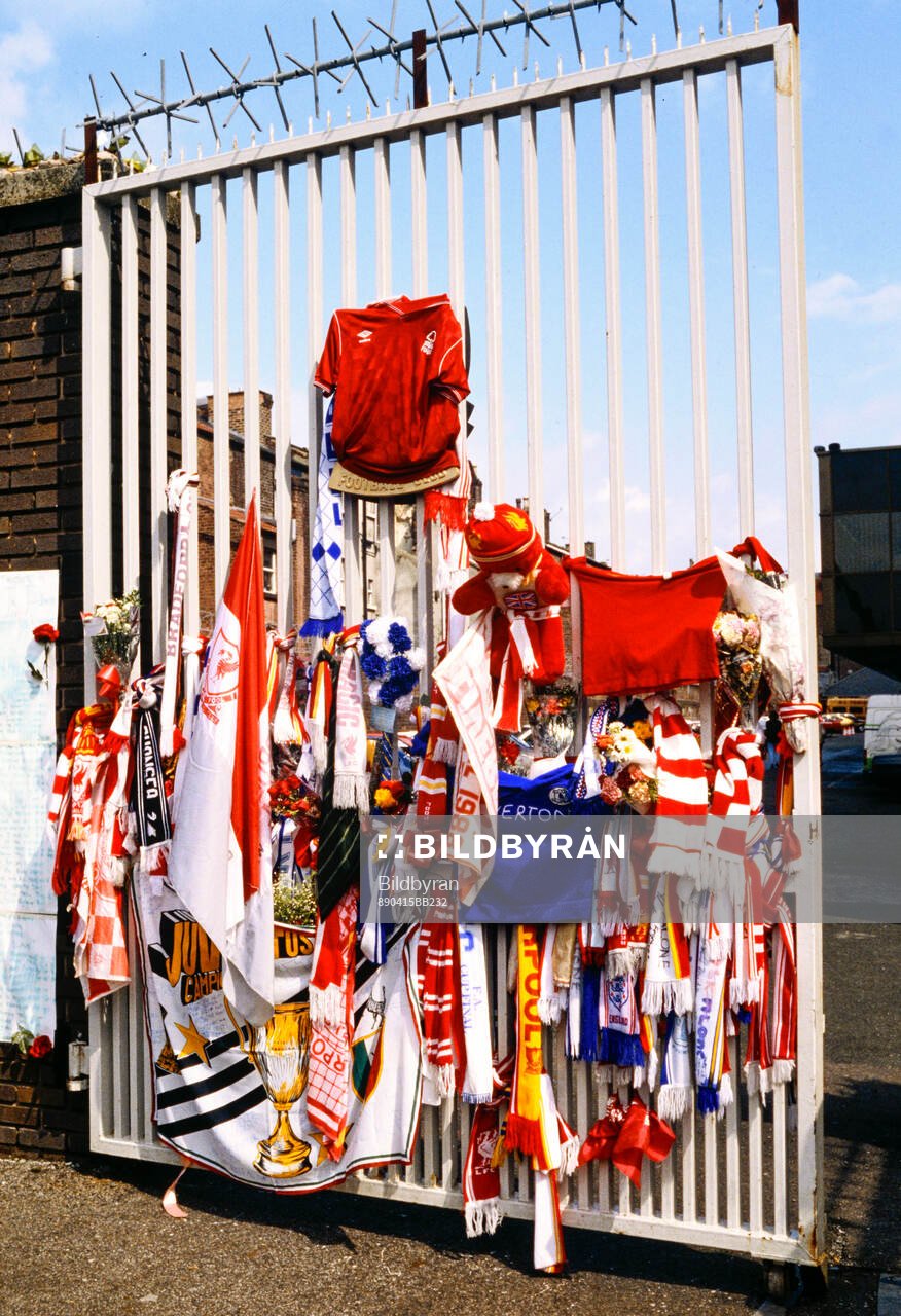 Scarves, shirts and flowers outside Anfield to pay tribute