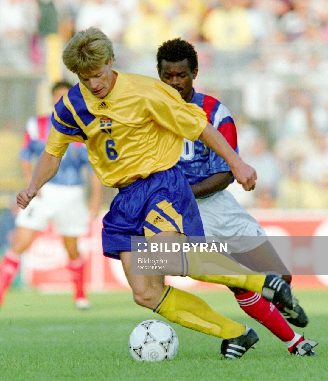 Stefan Schwarz of Sweden shields the ball in front of