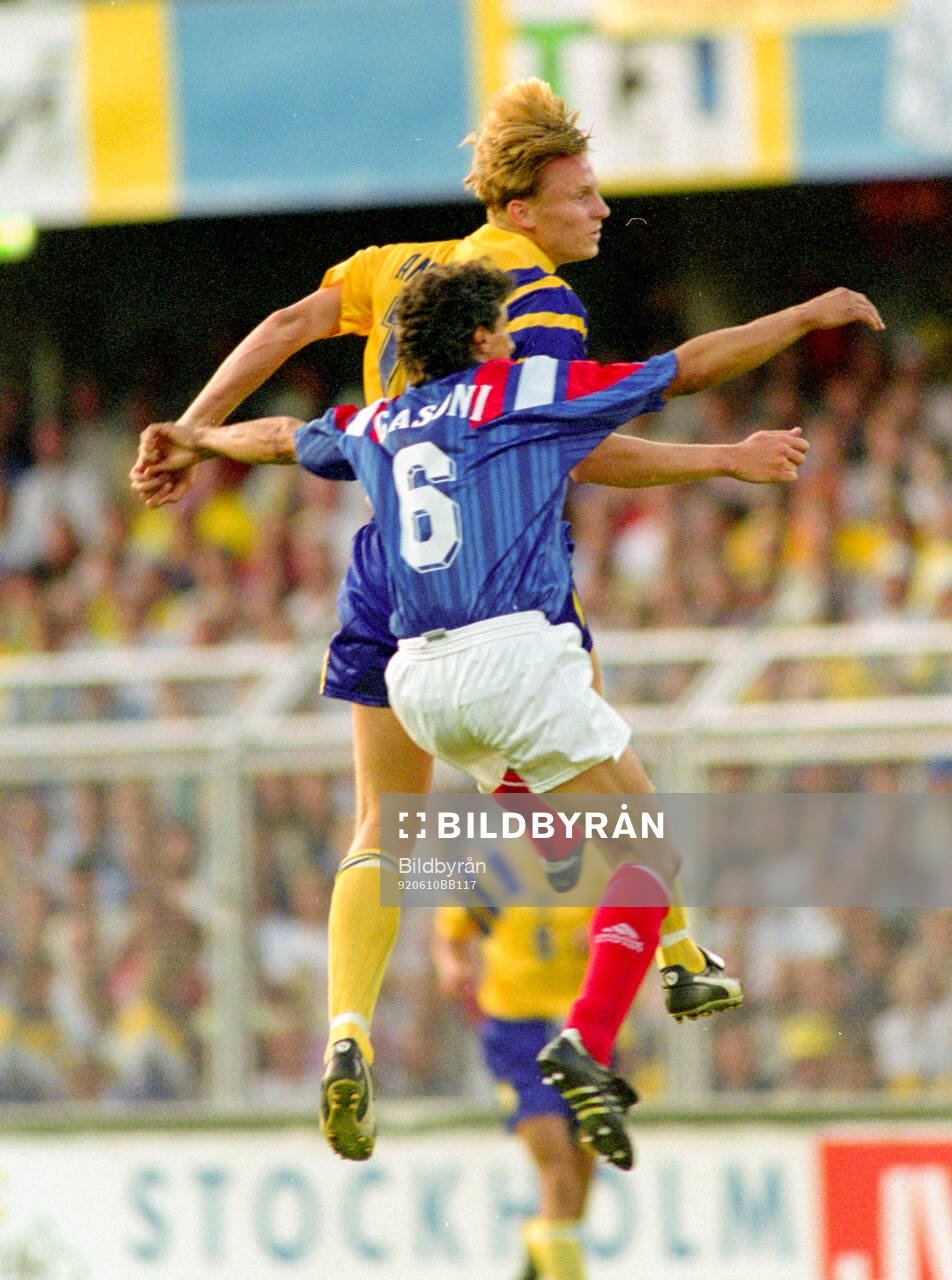 Swedens Kennet Andersson in an aerial duel against Barnard