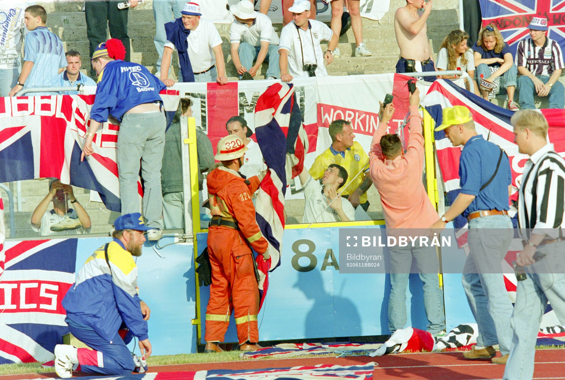 English fans with flags and banners in the stands