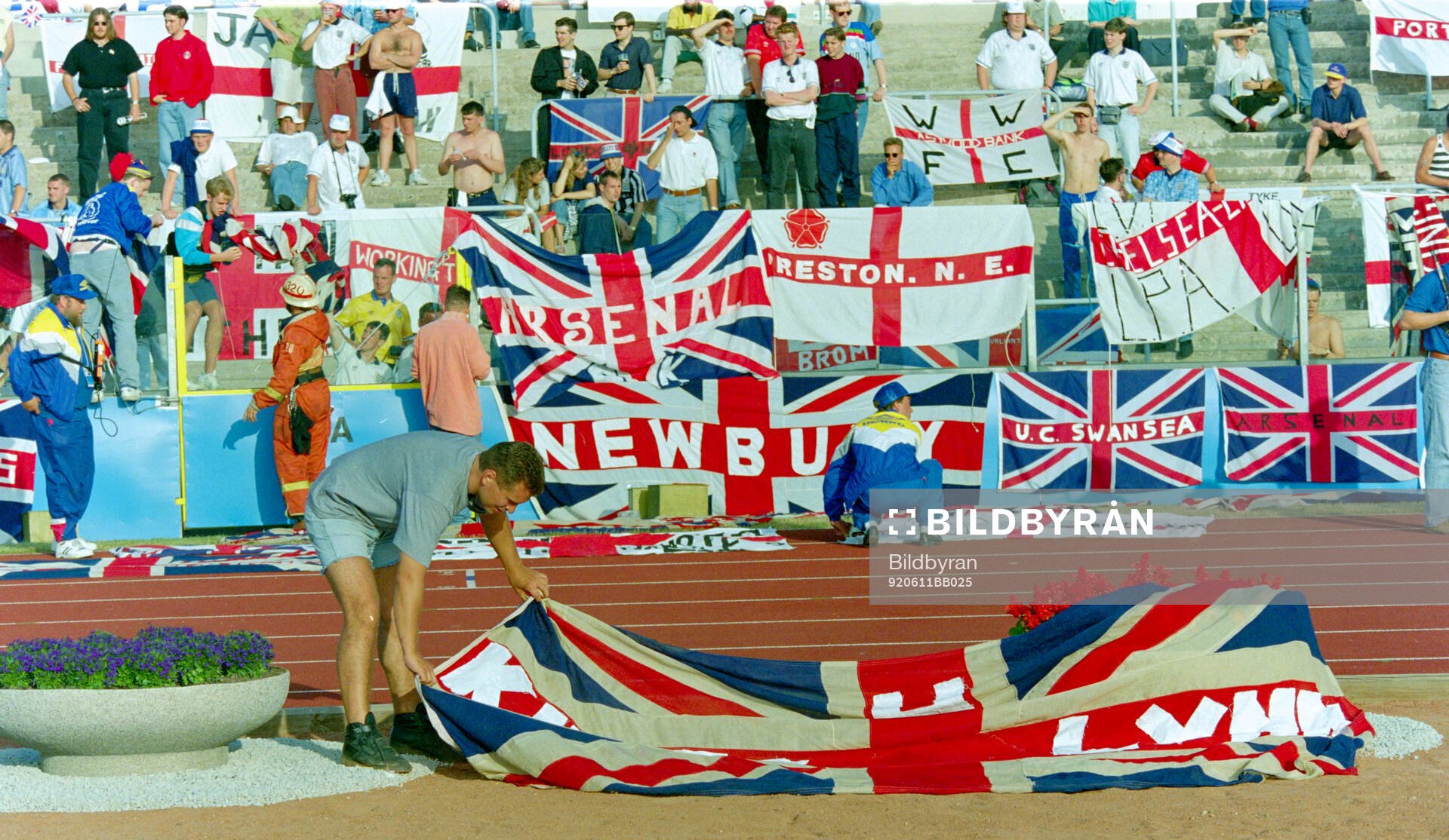 English fans with flags and banners in the stands