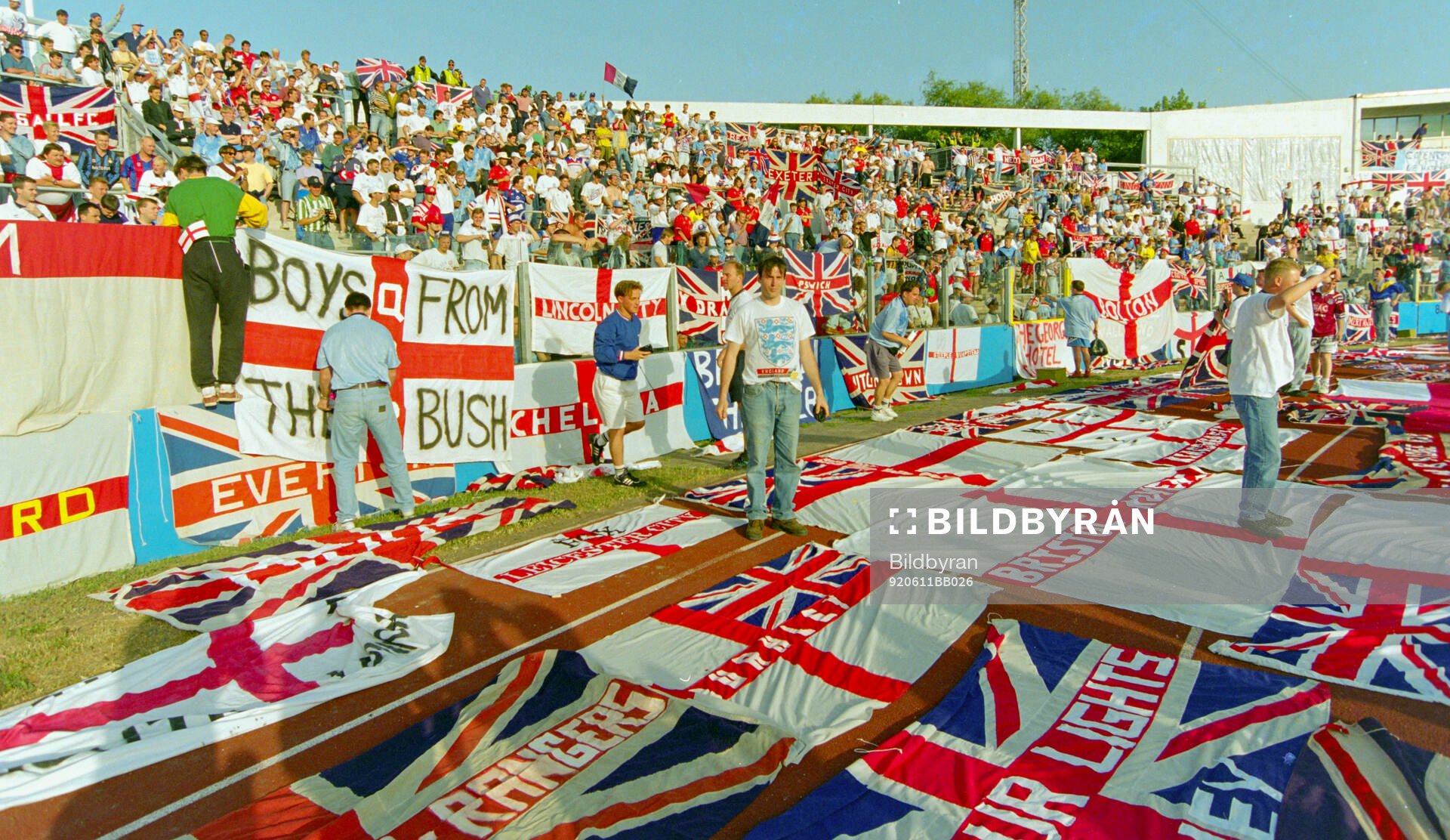 English fans with flags and banners in the stands