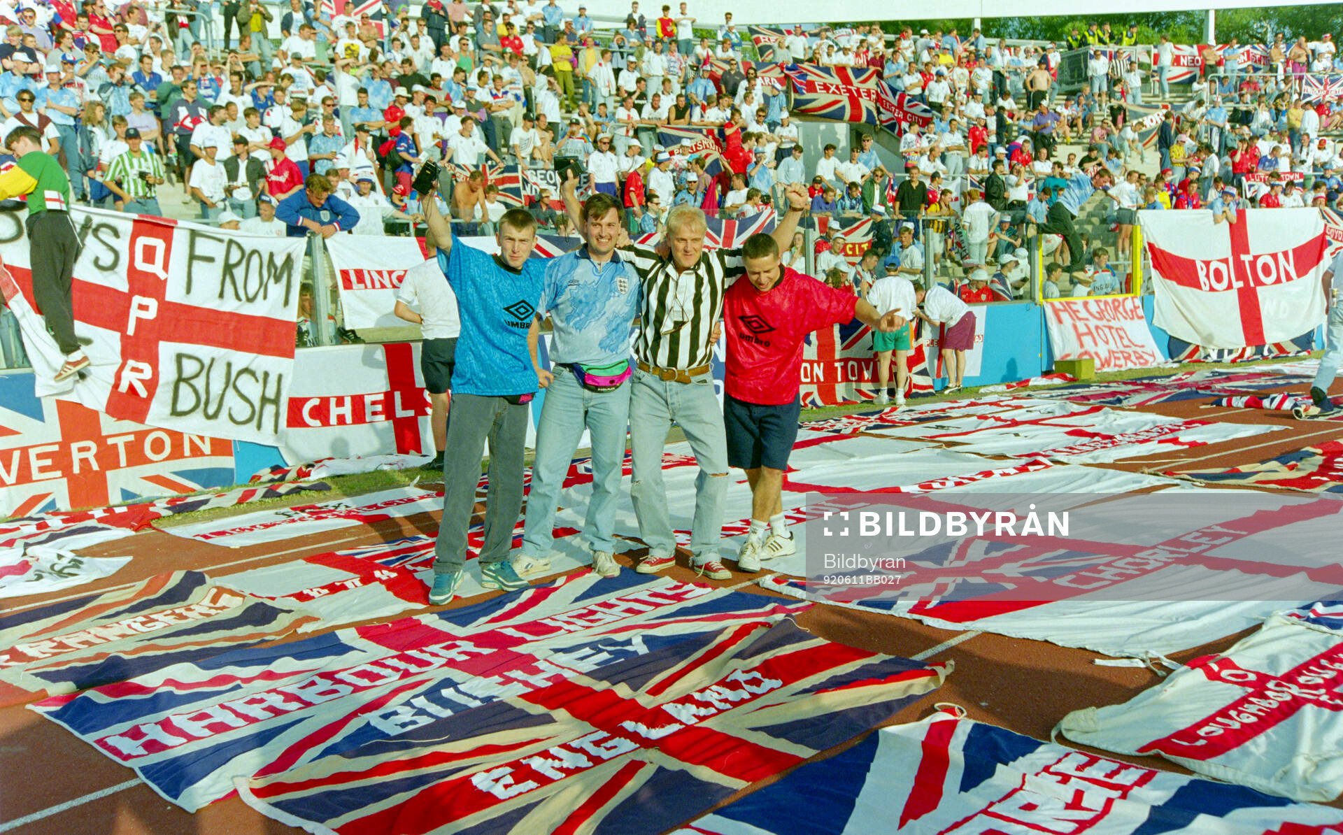 English fans with flags and banners in the stands