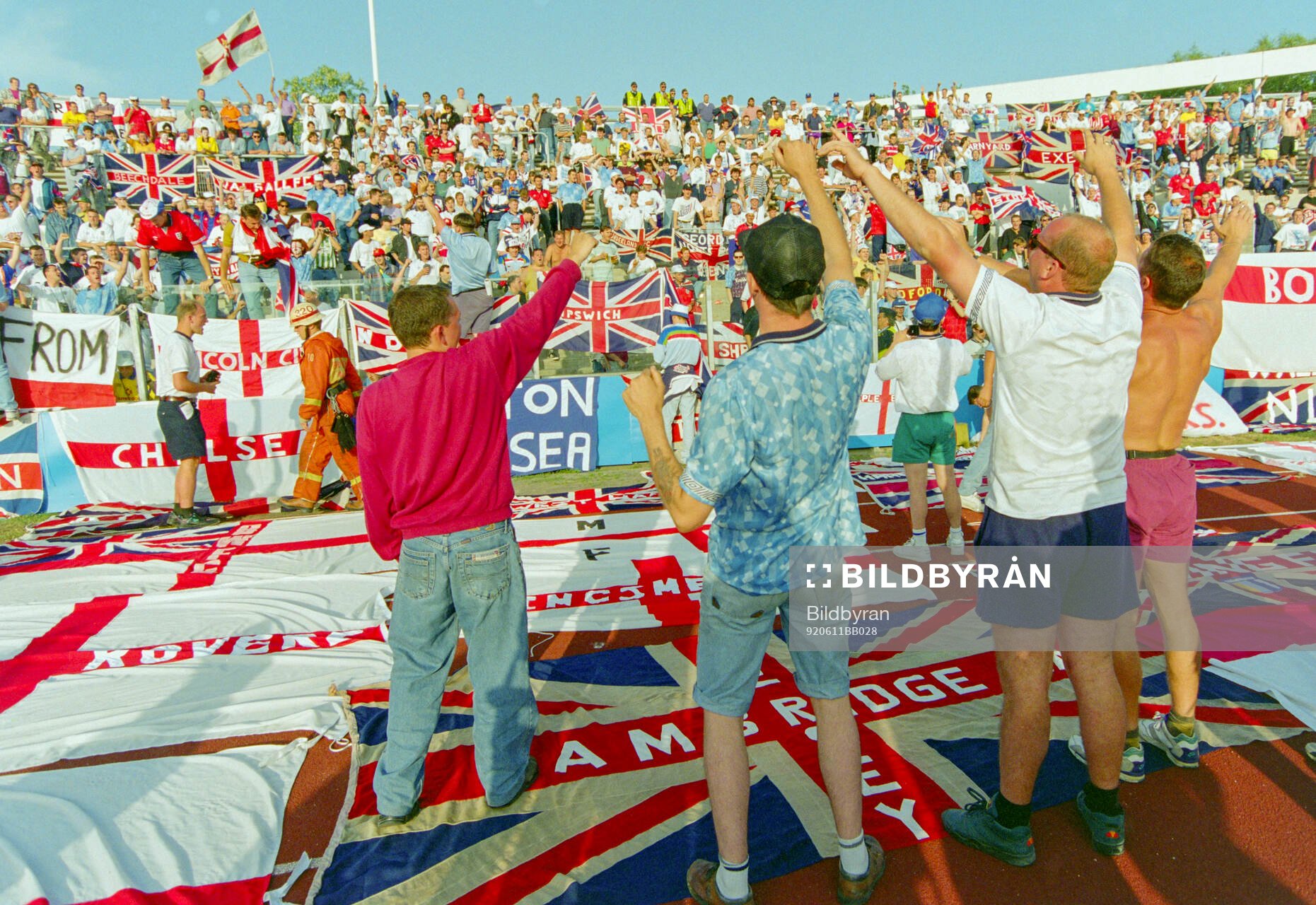 English fans with flags and banners in the stands