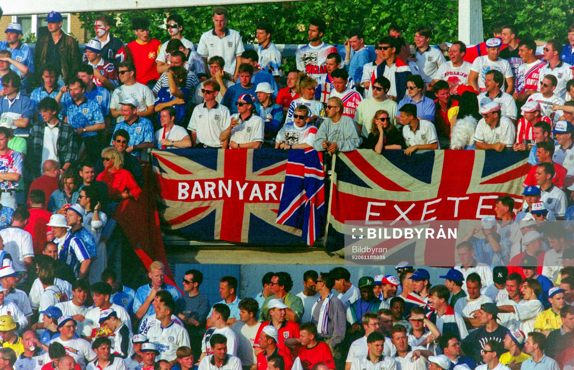 English fans with flags and banners in the stands