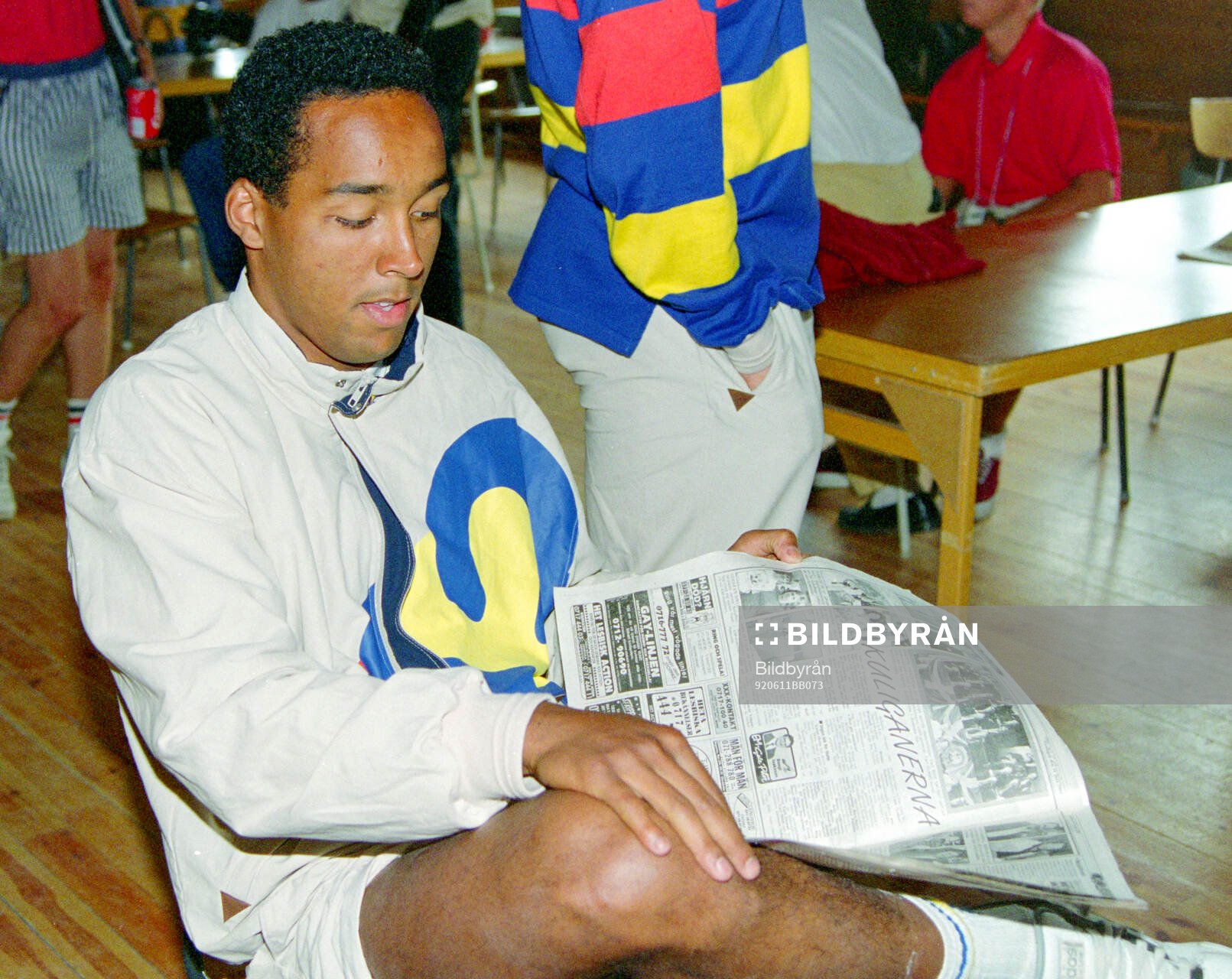 Swedish player Martin Dahlin reads sports pages about the