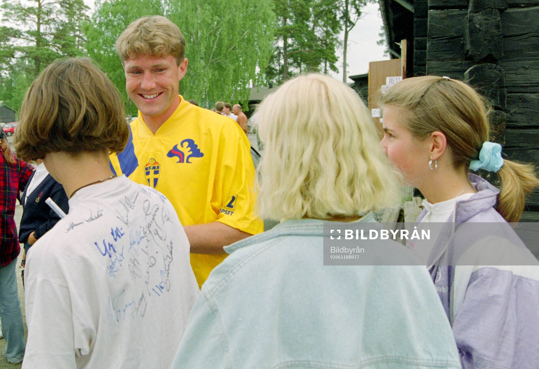 Swedens Jan Eriksson writes autographs to young fans at