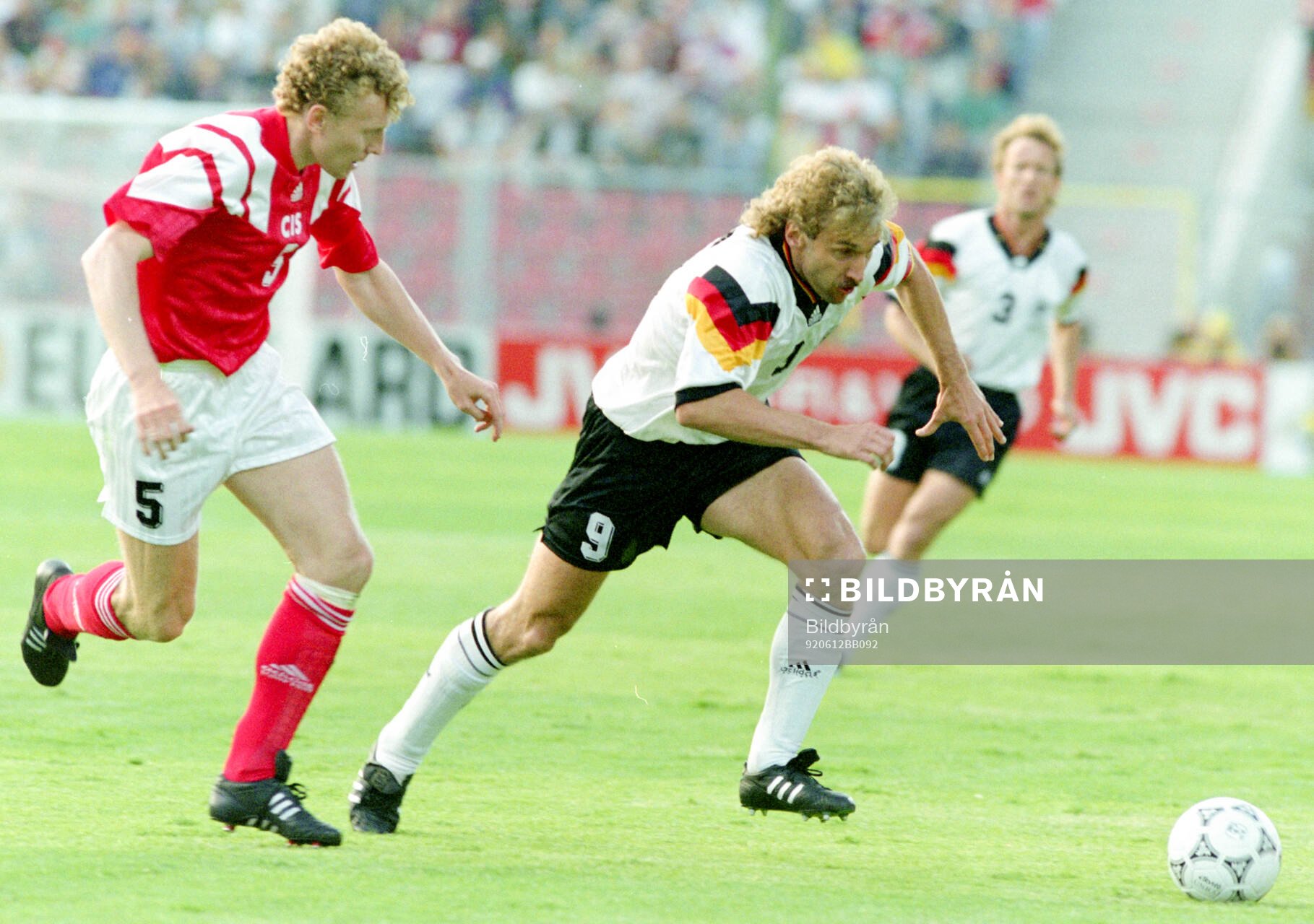 Germanys Rudi Voller against Oleg Kuznetsov of CIS