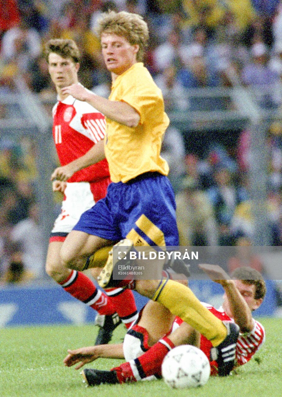 Swedens Stefan Schwarz is tackled by Denmarks John Jensen