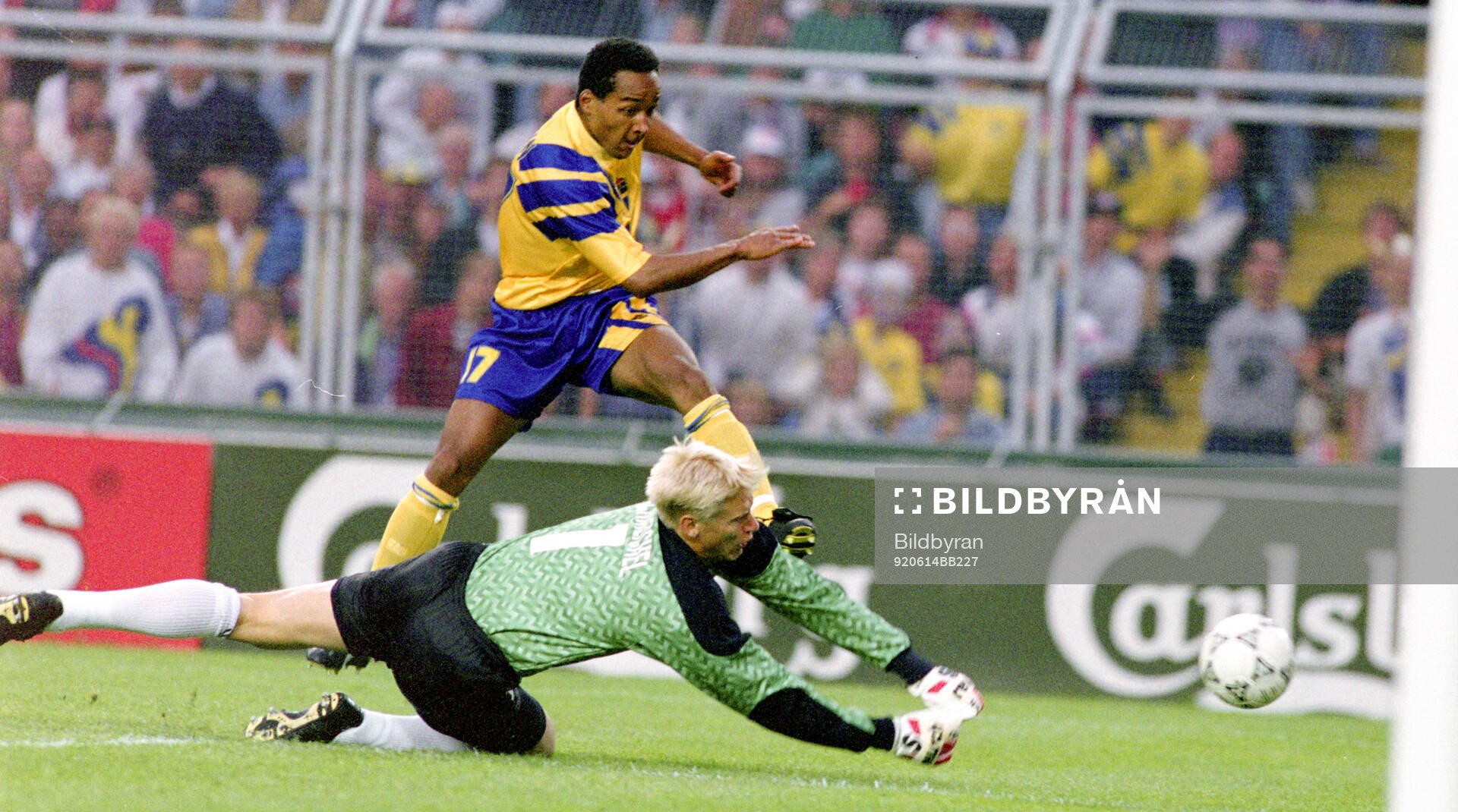 Swedens Martin Dahlin against Denmarks goalkeeper Peter