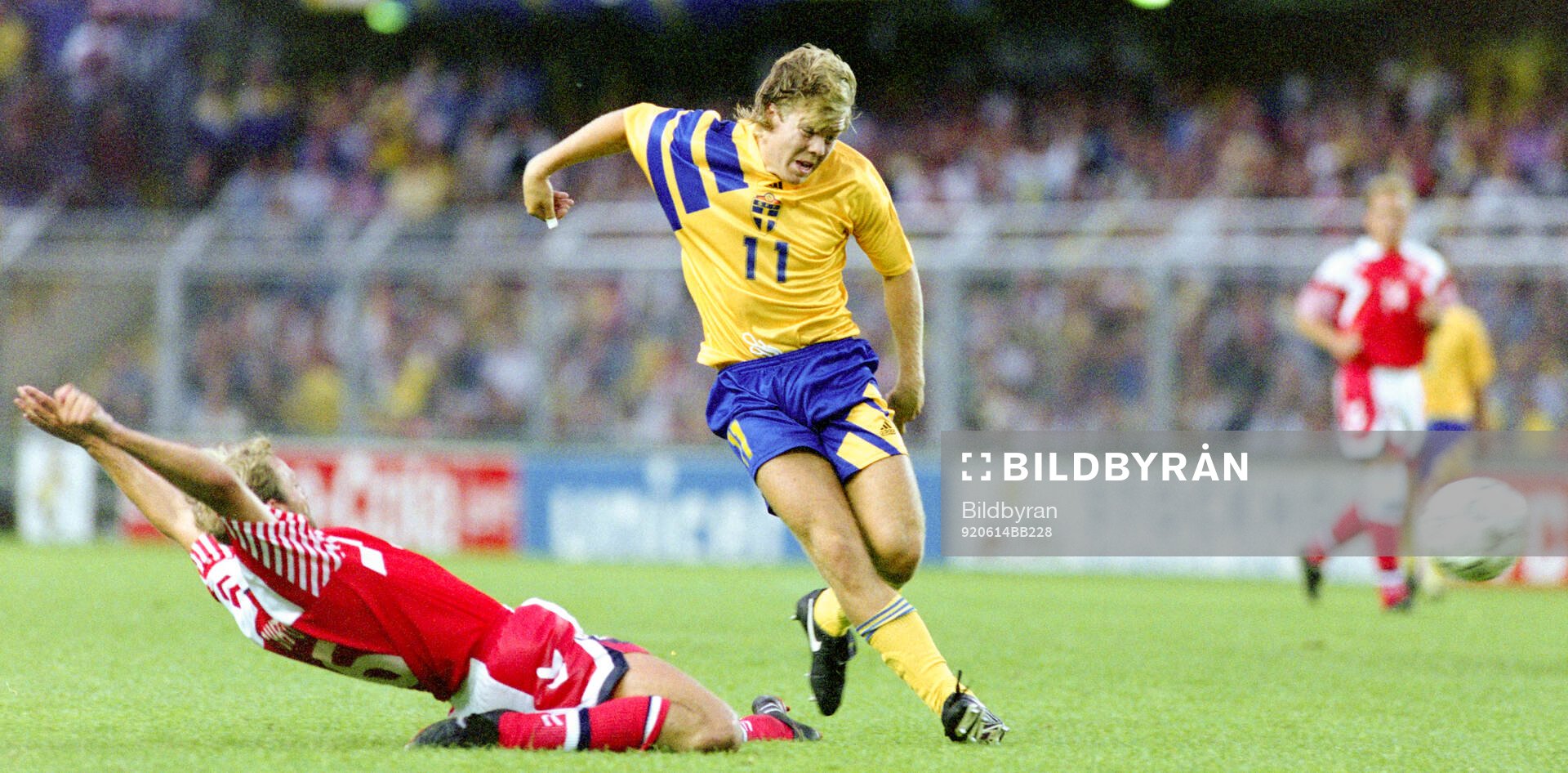 Swedens Tomas Brolin shoots at goal, left Denmarks Kim
