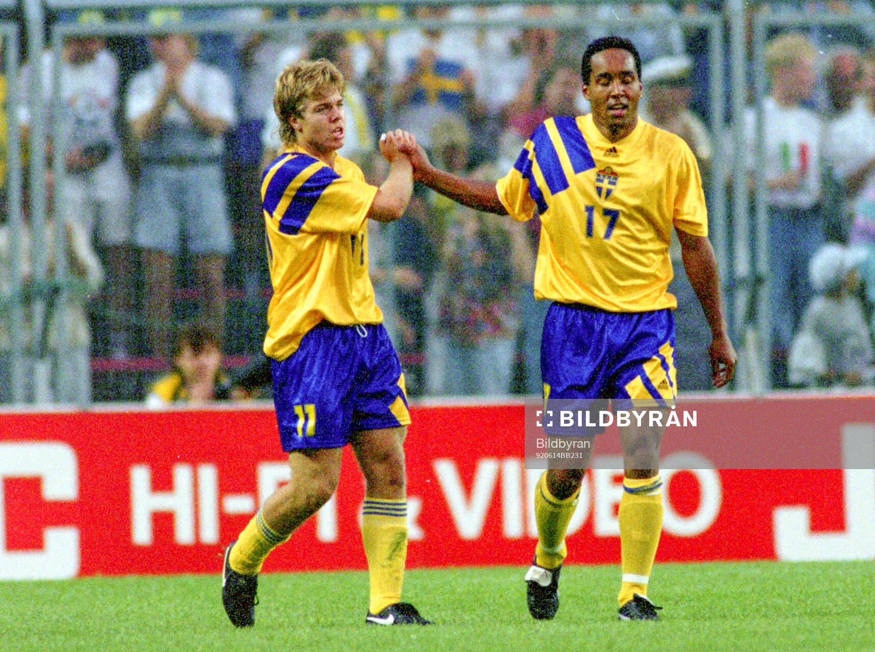 Swedens goalscorer Tomas Brolin (L) celebrates with Martin