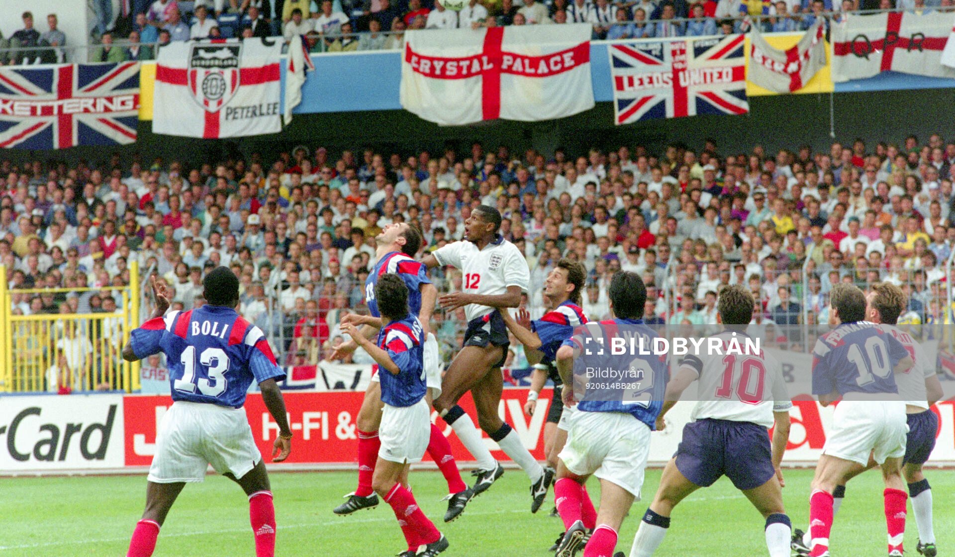 France’s Eric Cantona in an air duel against Englands