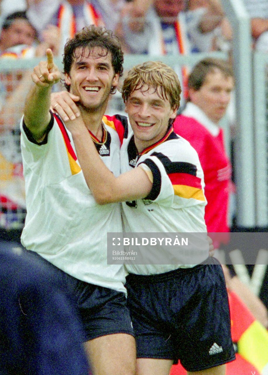 Germanys Karl-Heinz Riedle (L) celebrates his 1-0 goal with