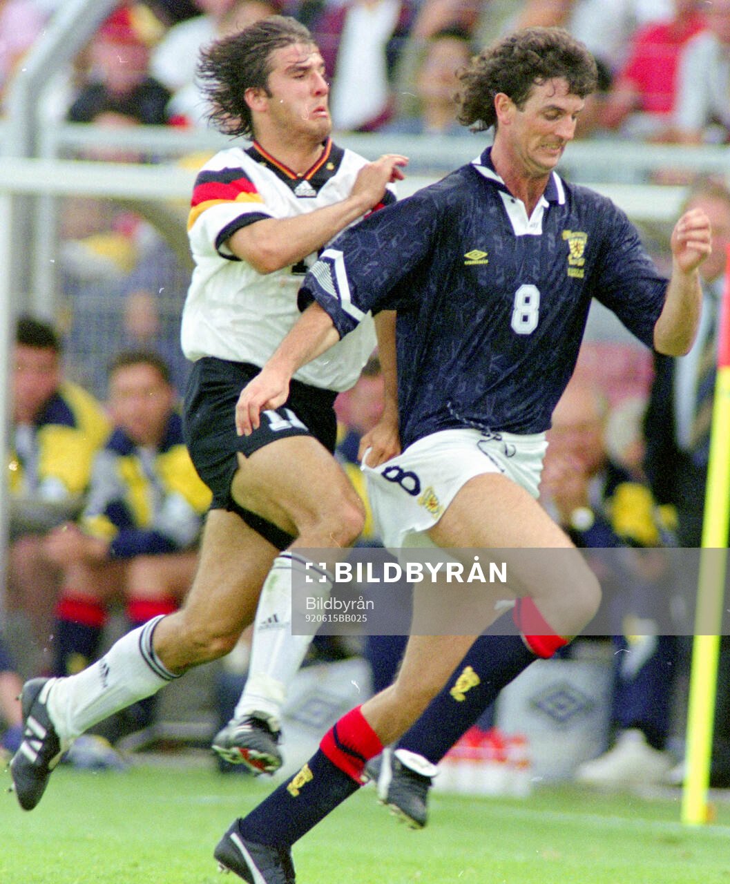 Germanys Karl-Heinz Riedle (L) against Scotlands Dave Mc