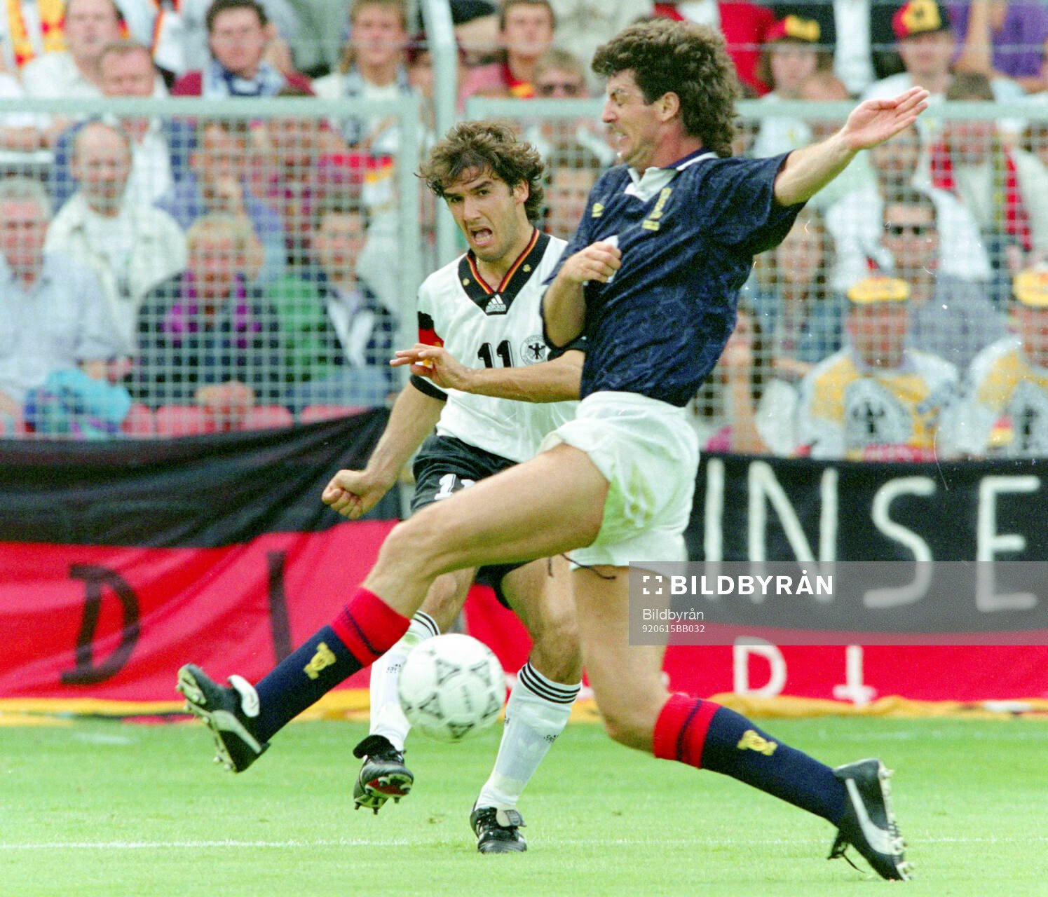 Germanys Karl-Heinz Riedle (L) against Scotlands Dave