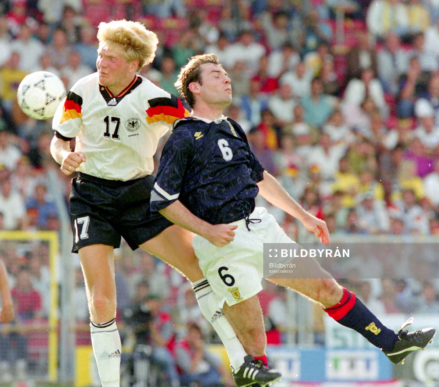 Germanys Stefan Effenberg (L) against Scotlands Brian