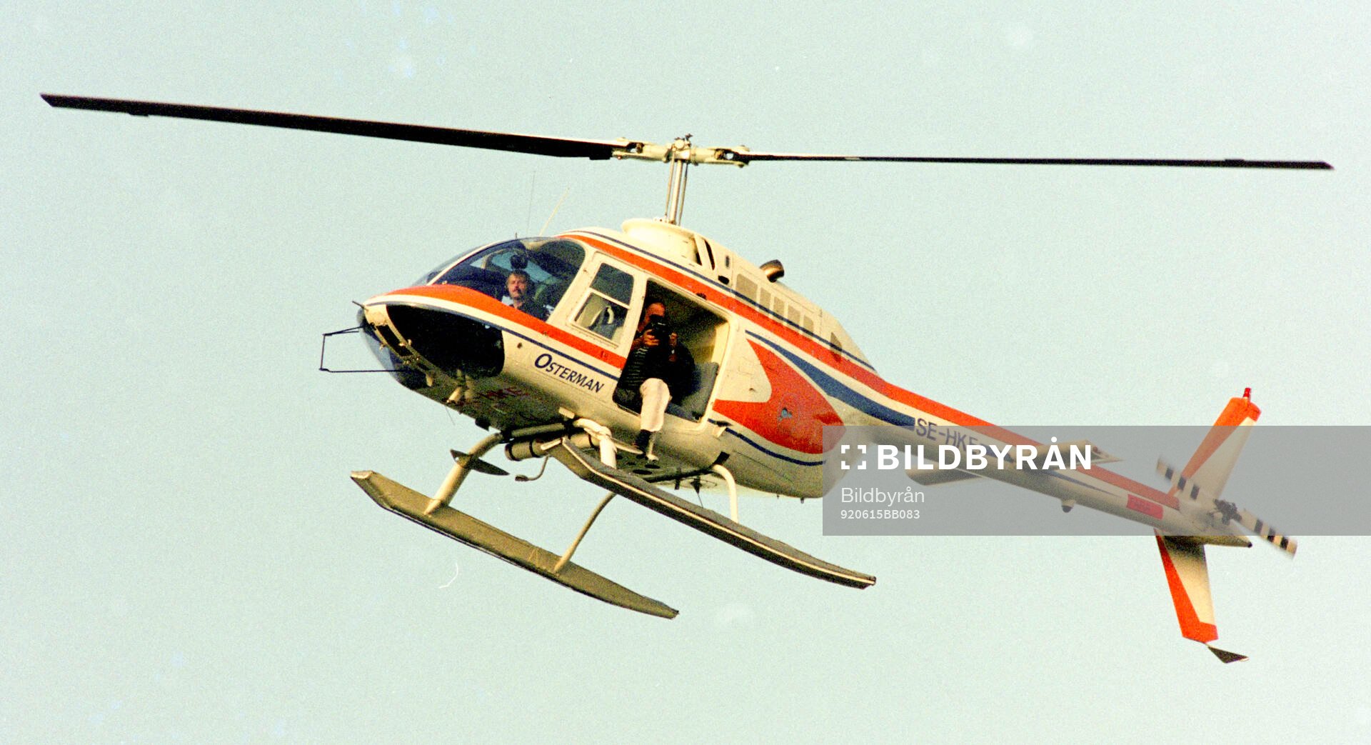 A helicopter with a photographer hovering over Nya Ullevi