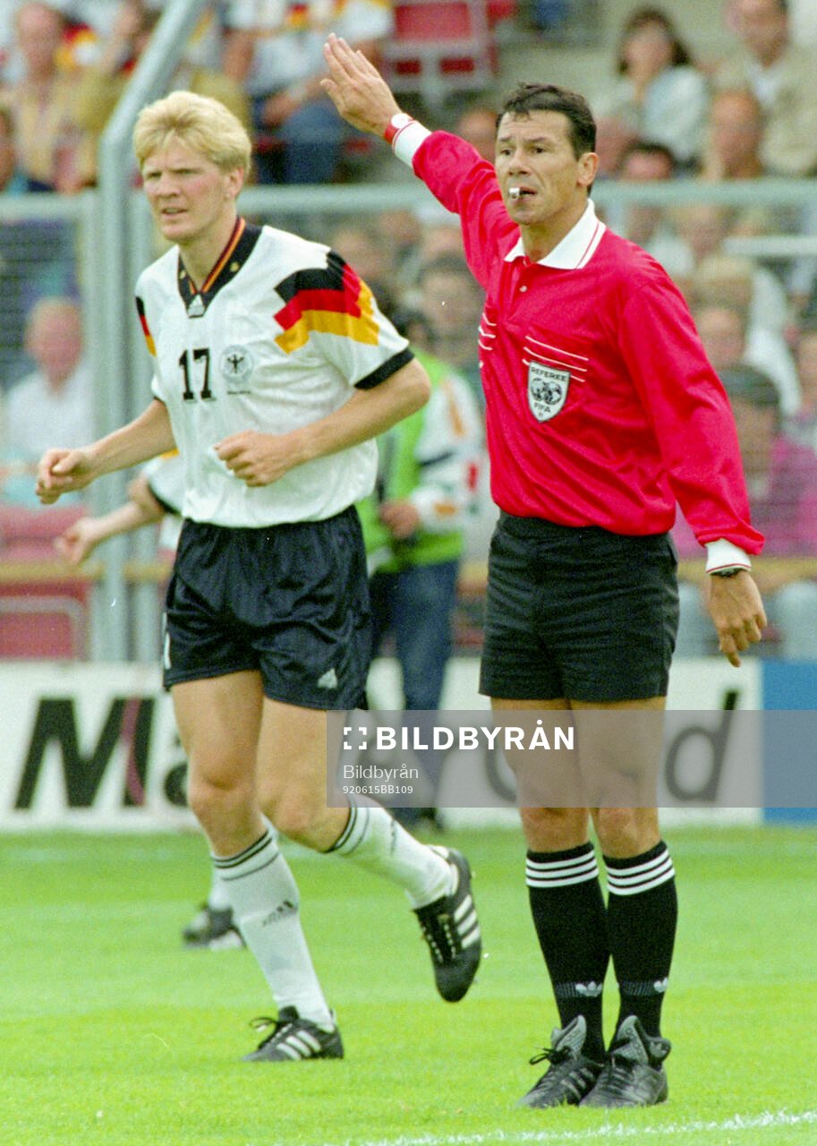 Referee Guy Goethals, left Germanys Stefan Effenberg