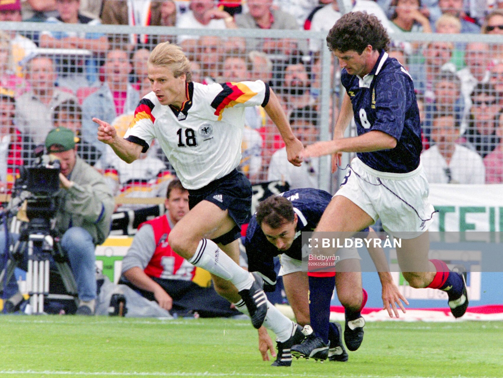Germanys Jurgen Klinsmann against Scotlands Dave McPherson