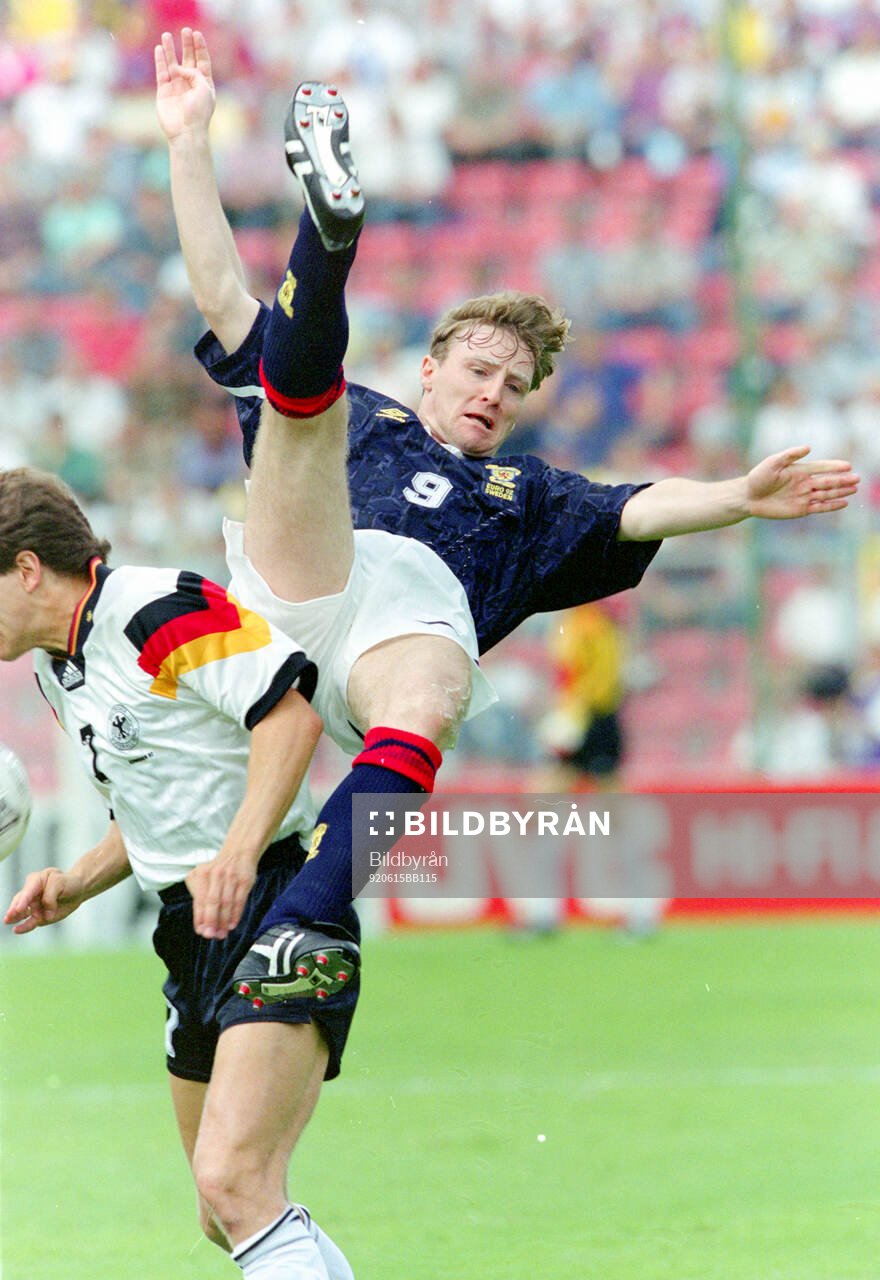 Scotlands Stewart McKimmie against Germanys Andreas Möller