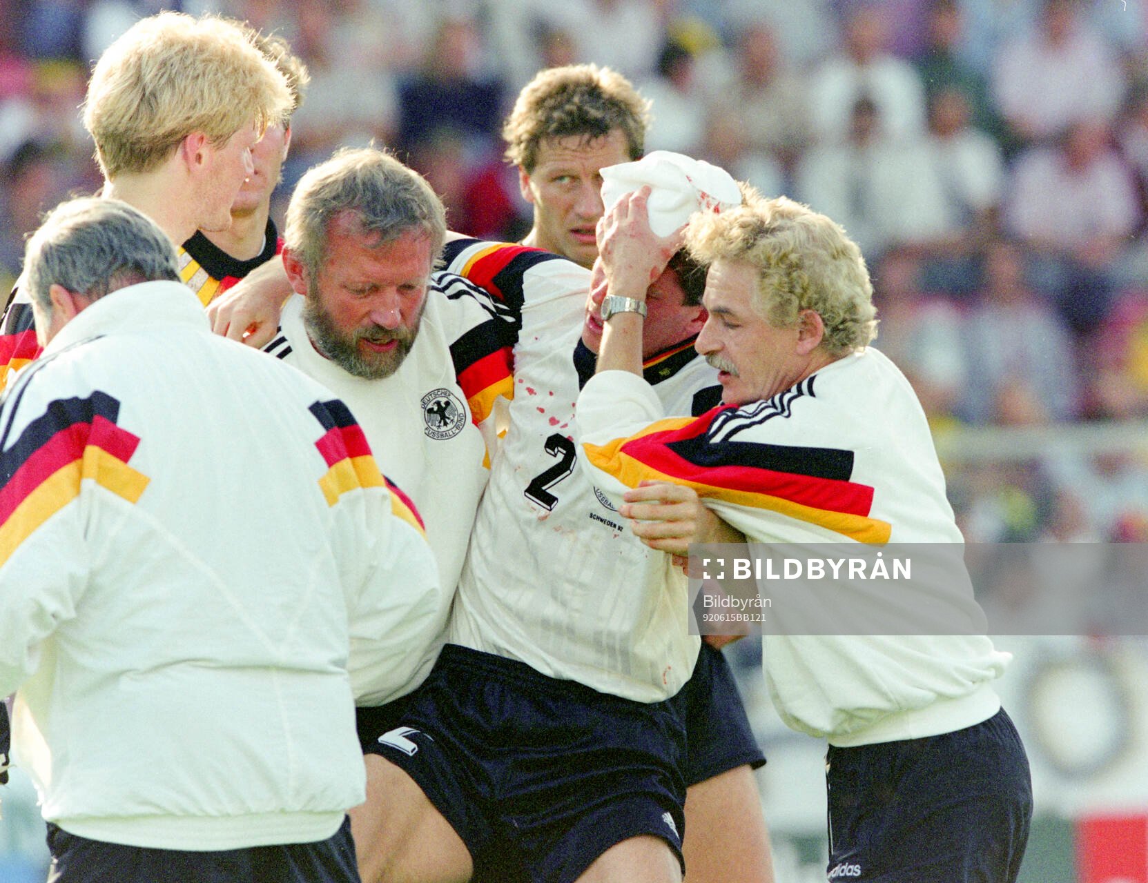 Germanys Stefan Reuter is carried off the pitch