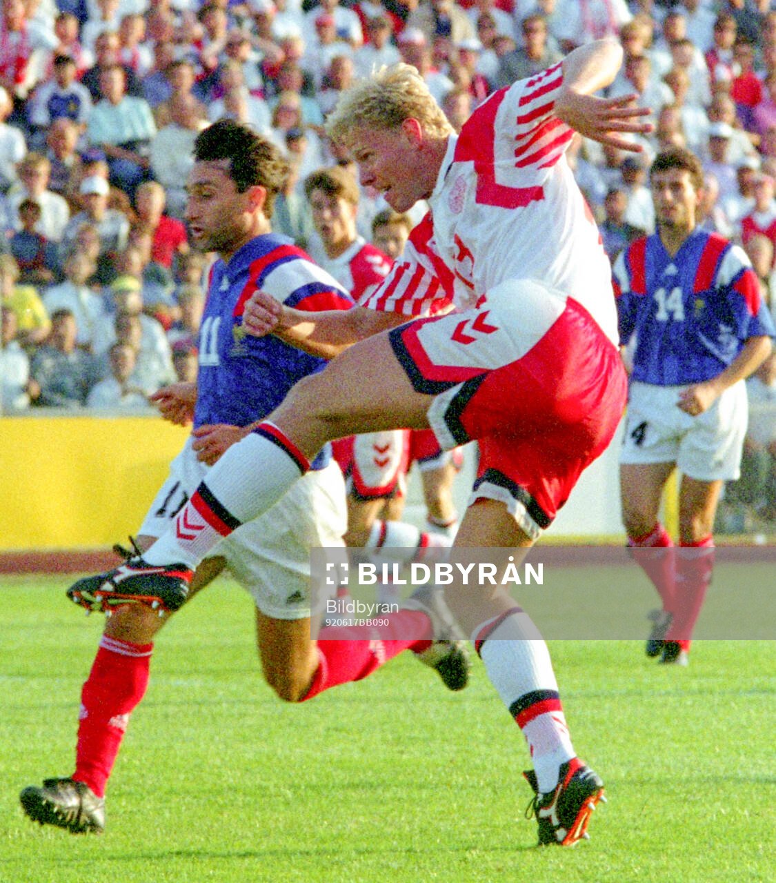 Denmarks Henrik Larsen shoots to score his 1-0 goal