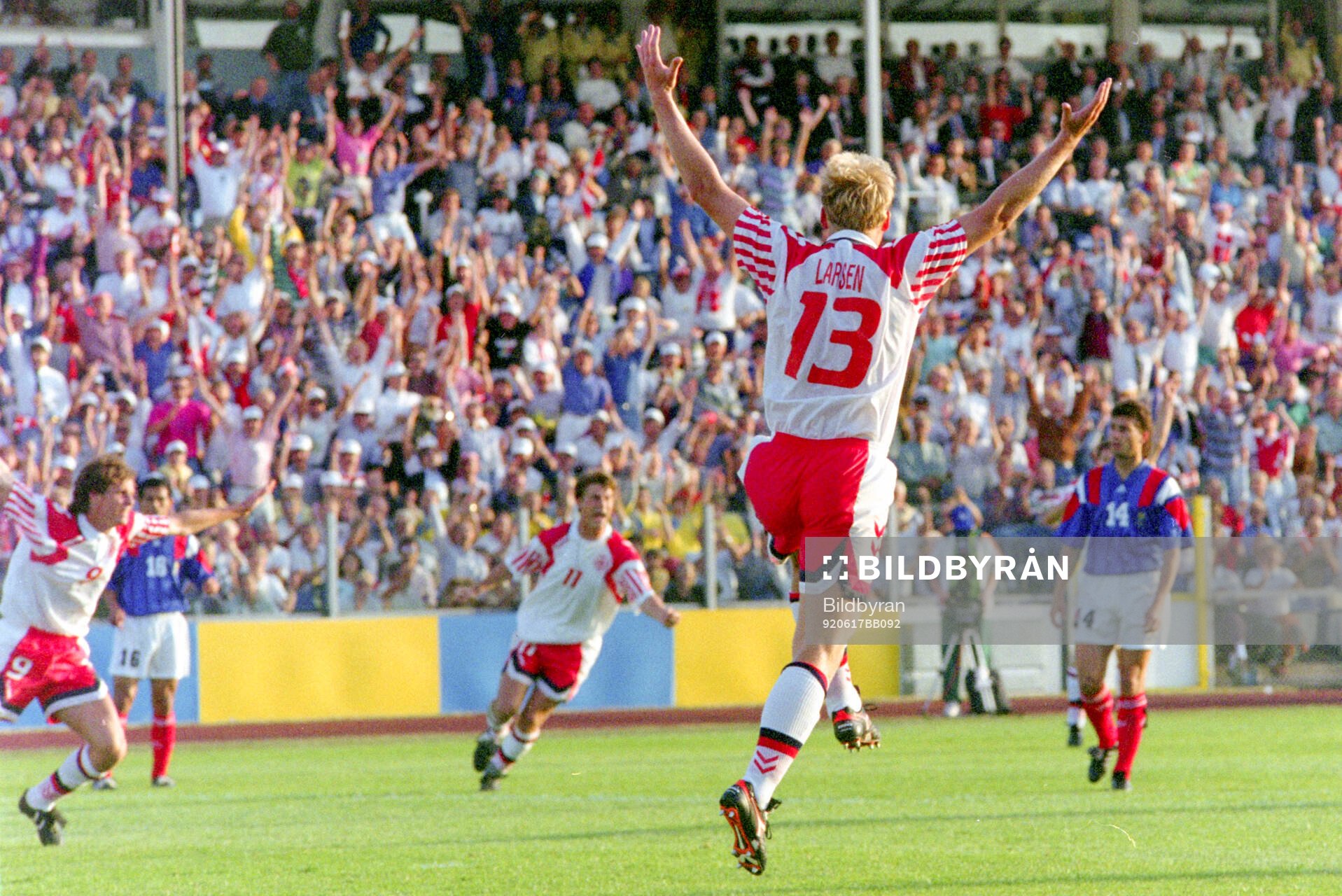 Denmarks Henrik Larsen celebrates his 1-0 goal