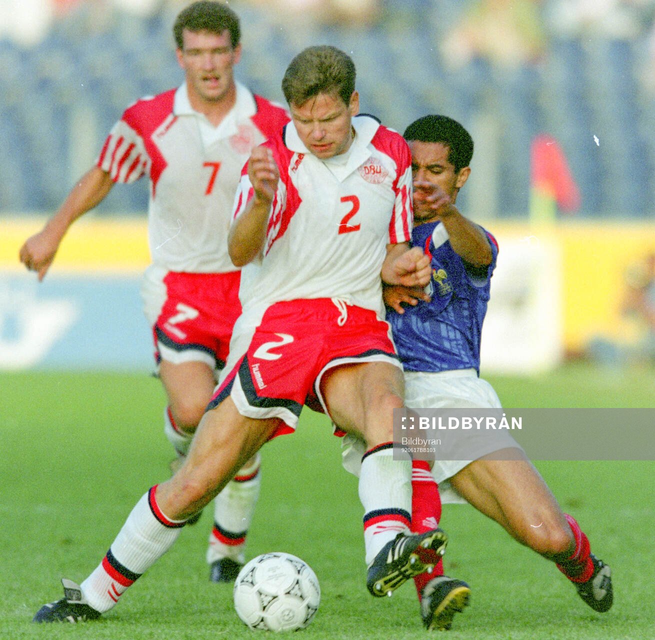 Denmarks John Sivebaek against France‚Äôs Pascal Vahirua